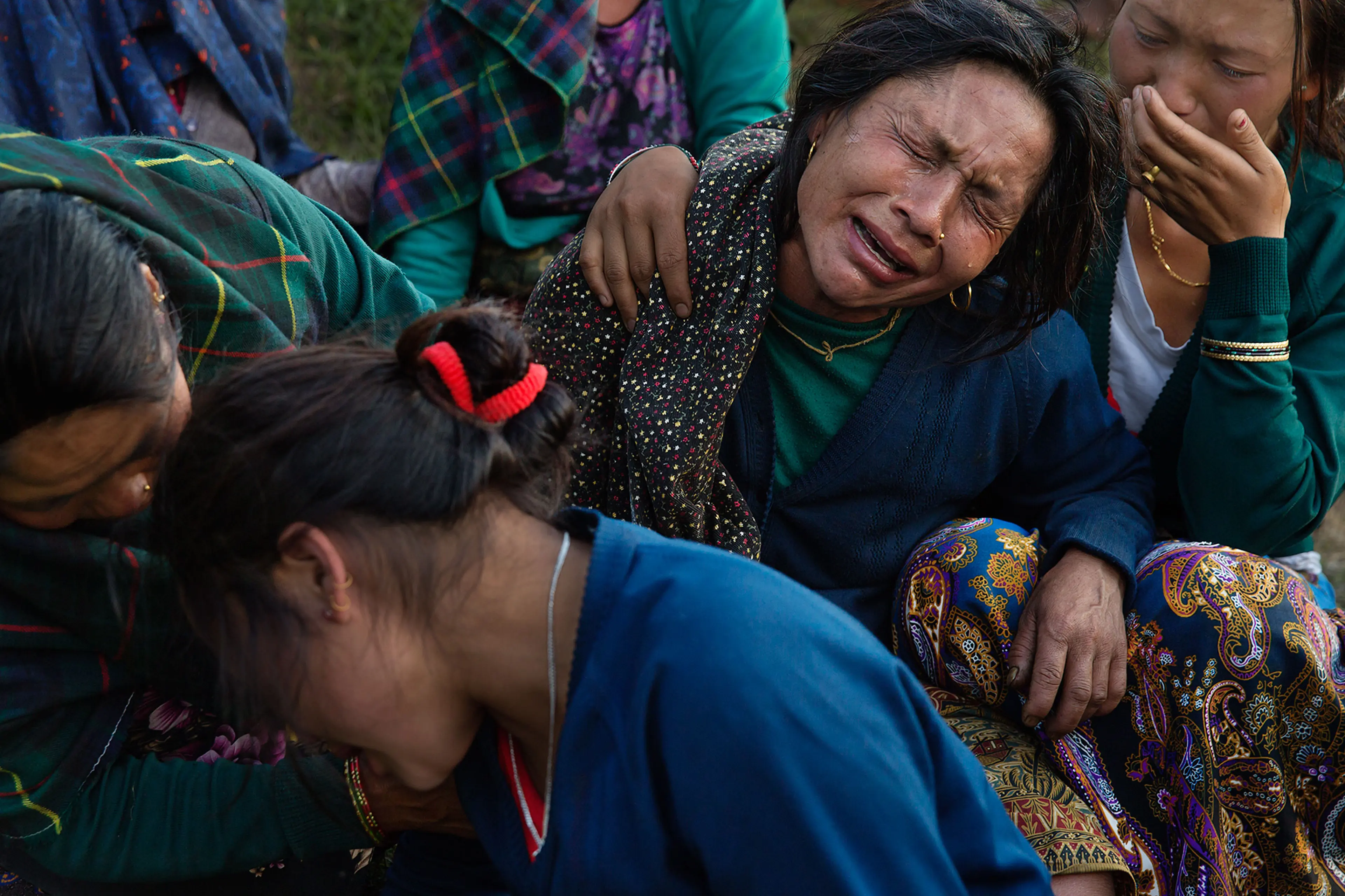 Nepal earthquake. Barpak, the epicenter of the earthquake. Funeral of Pur Bahadur Gurung, 26, who had just been dug out of the rubble. Saainli Gurung, his mother weeping. Scenes of villagers salvaging building materials and personal possessions. Dhan Raj
