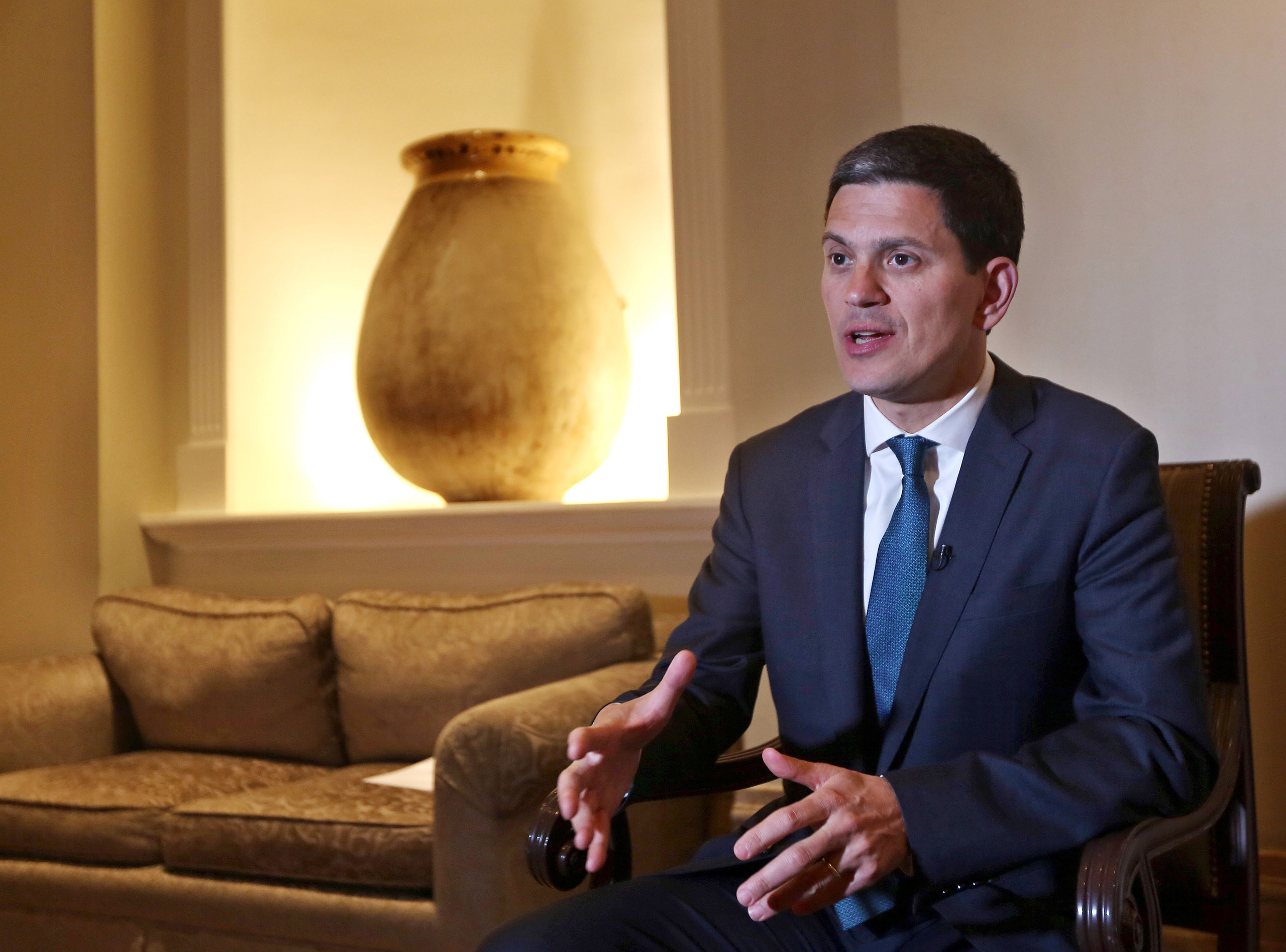 David Miliband, the President and CEO of the International Rescue Committee, speaks during an interview with The Associated Press in Beirut, Lebanon, Thursday, April 9, 2015. Miliband says that the whole international community shares responsibility for 