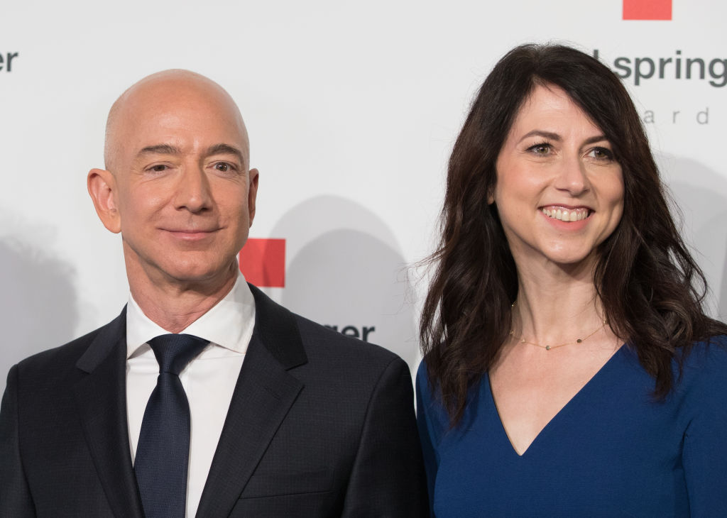 MacKenzie Bezos committed to giving away at least half of the $37 billion fortune after her divorce from Amazon.com Inc. founder Jeff Bezos.