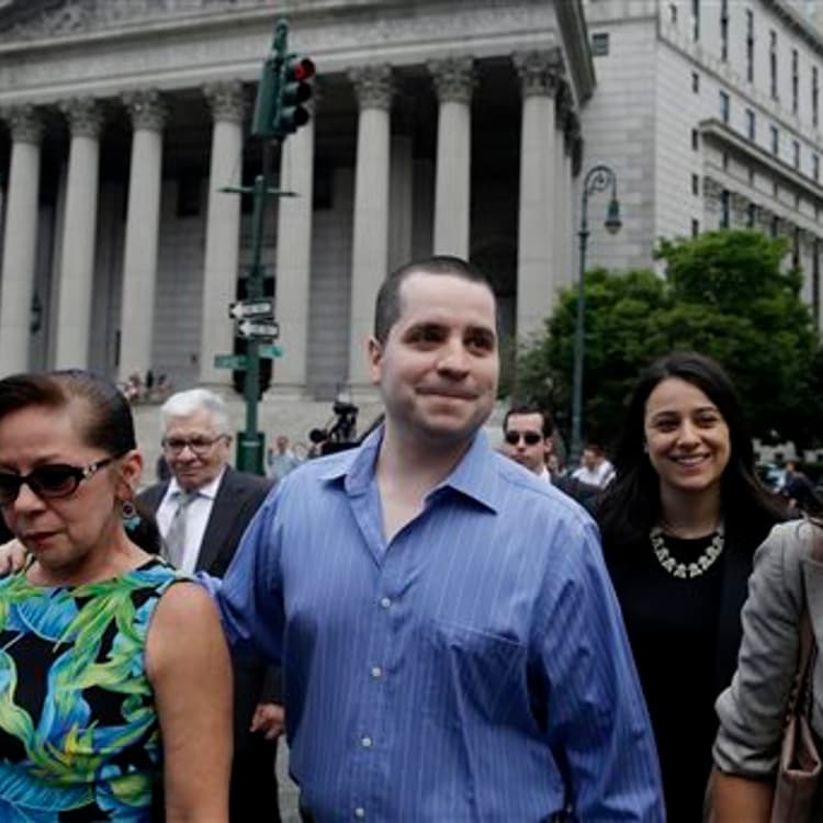 GIlberto Valle, center, leaves Manhattan federal court in New York on Tuesday, July 1, 2014.
