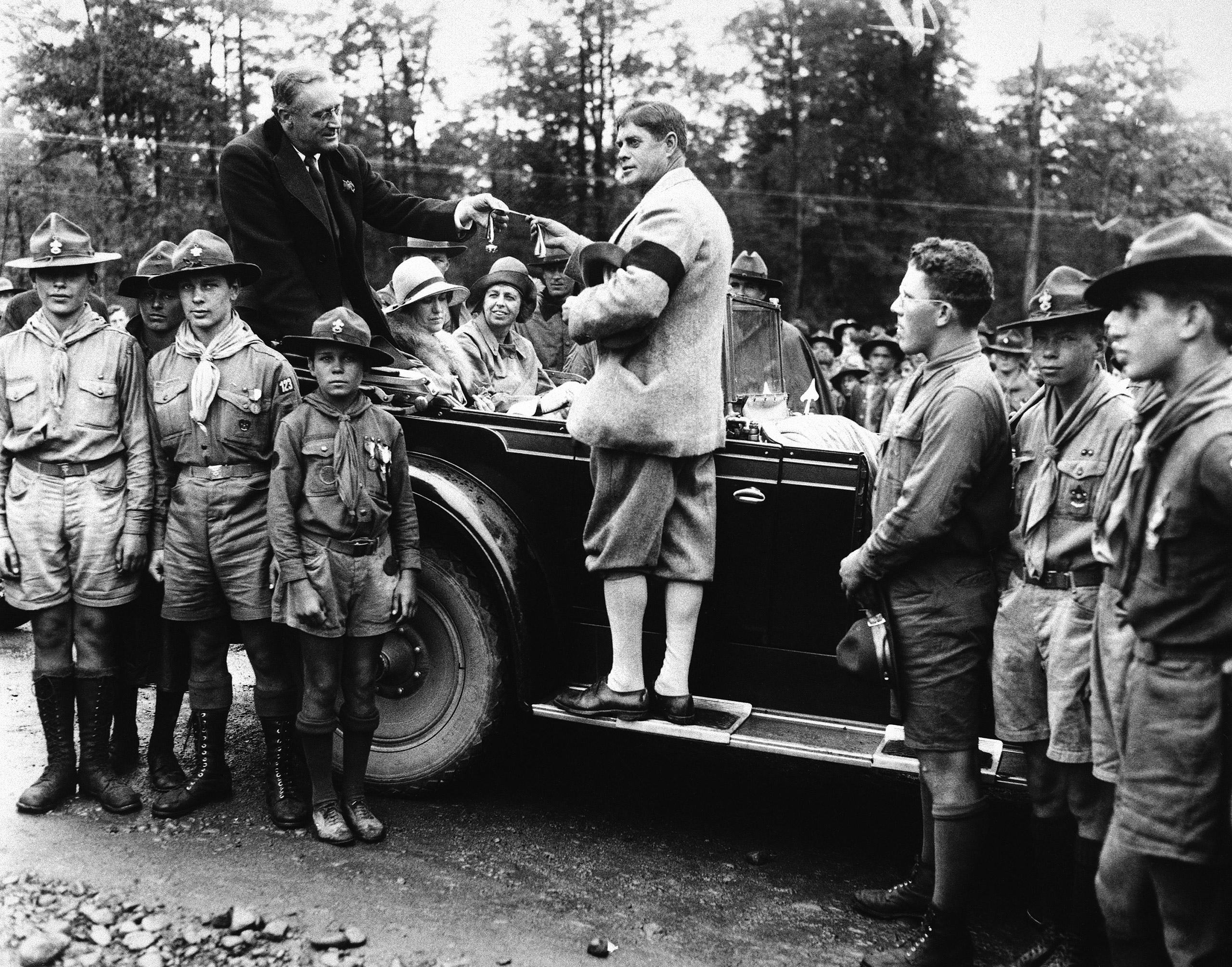 Governor Franklin D. Roosevelt, of New York, receiving the Medal of highest distinction as a gift of the boy scouts of America, from Judge Kernochan of the Court of General sessions, while on a visit August 23, 1930. The award was presented at the Ten Mi