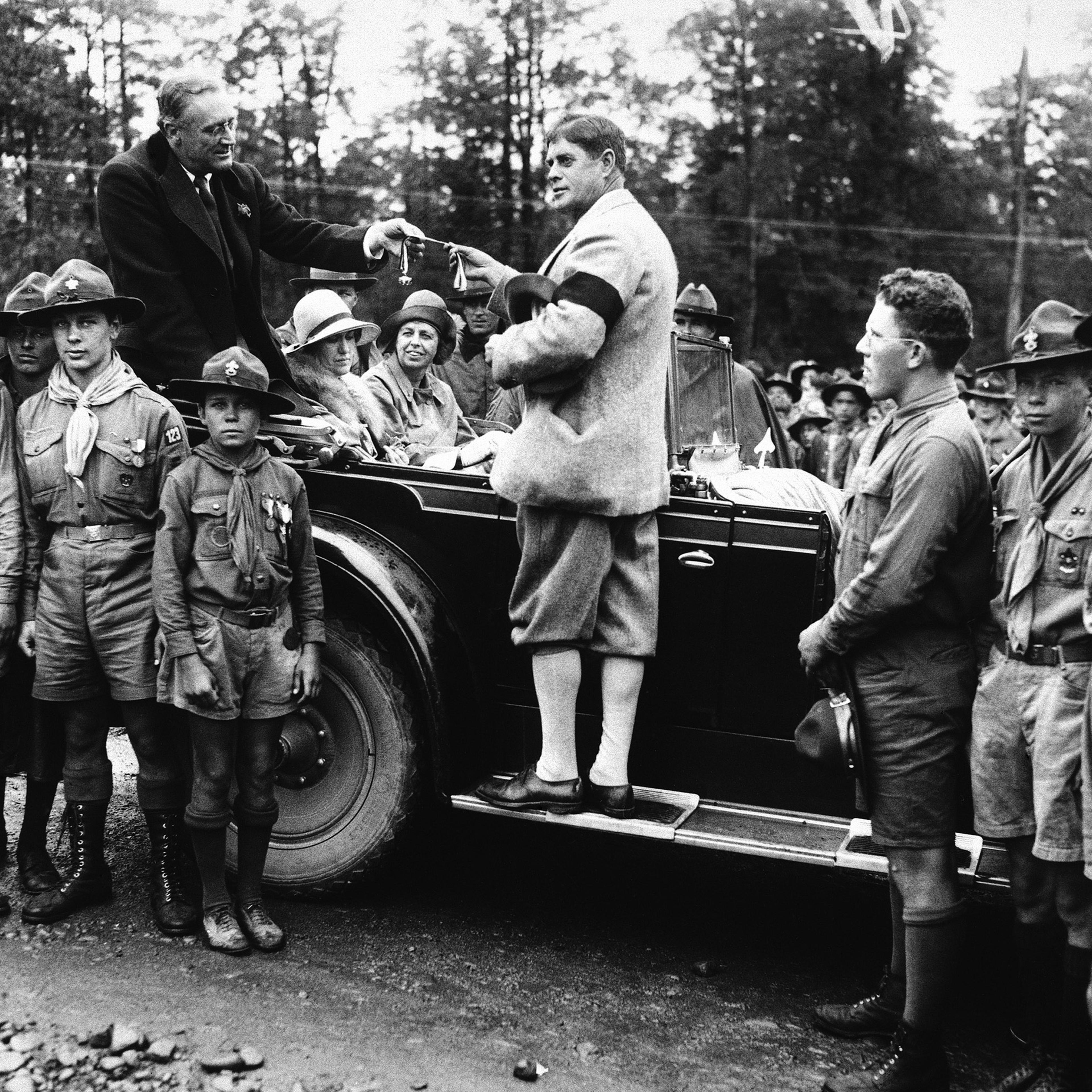 Governor Franklin D. Roosevelt, of New York, receiving the Medal of highest distinction as a gift of the boy scouts of America, from Judge Kernochan of the Court of General sessions, while on a visit August 23, 1930. The award was presented at the Ten Mi