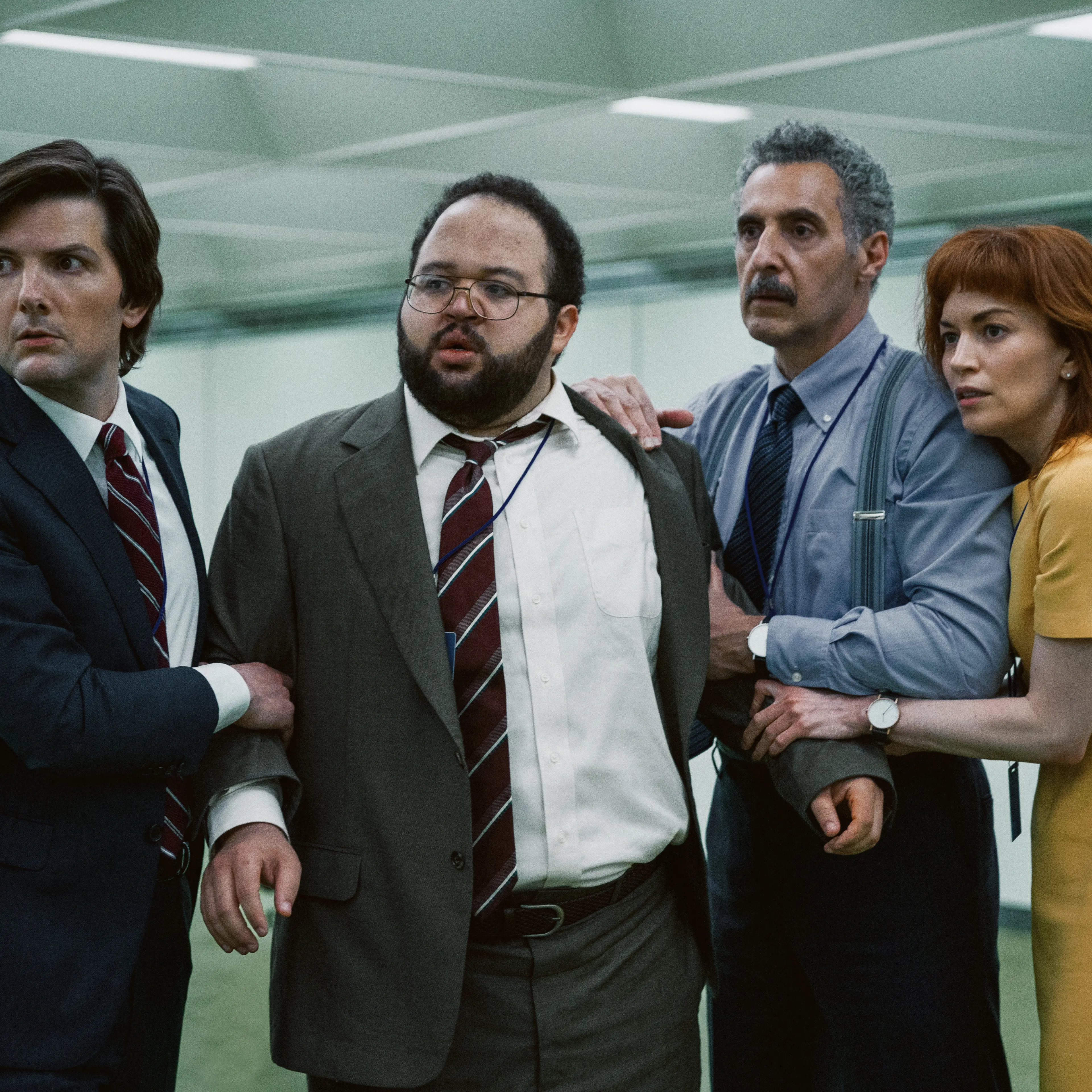(L-R) Adam Scott, Zach Cherry, John Turturro, and Britt Lower in <i>Severance</i>