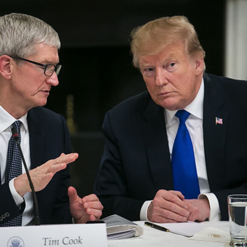 Tim Cook, chief executive officer of Apple Inc., speaks with U.S. President Donald Trump during an American Workforce Policy Advisory board meeting in the State Dining Room of the White House in Washington, D.C., U.S., on Wednesday, March 6, 2019.