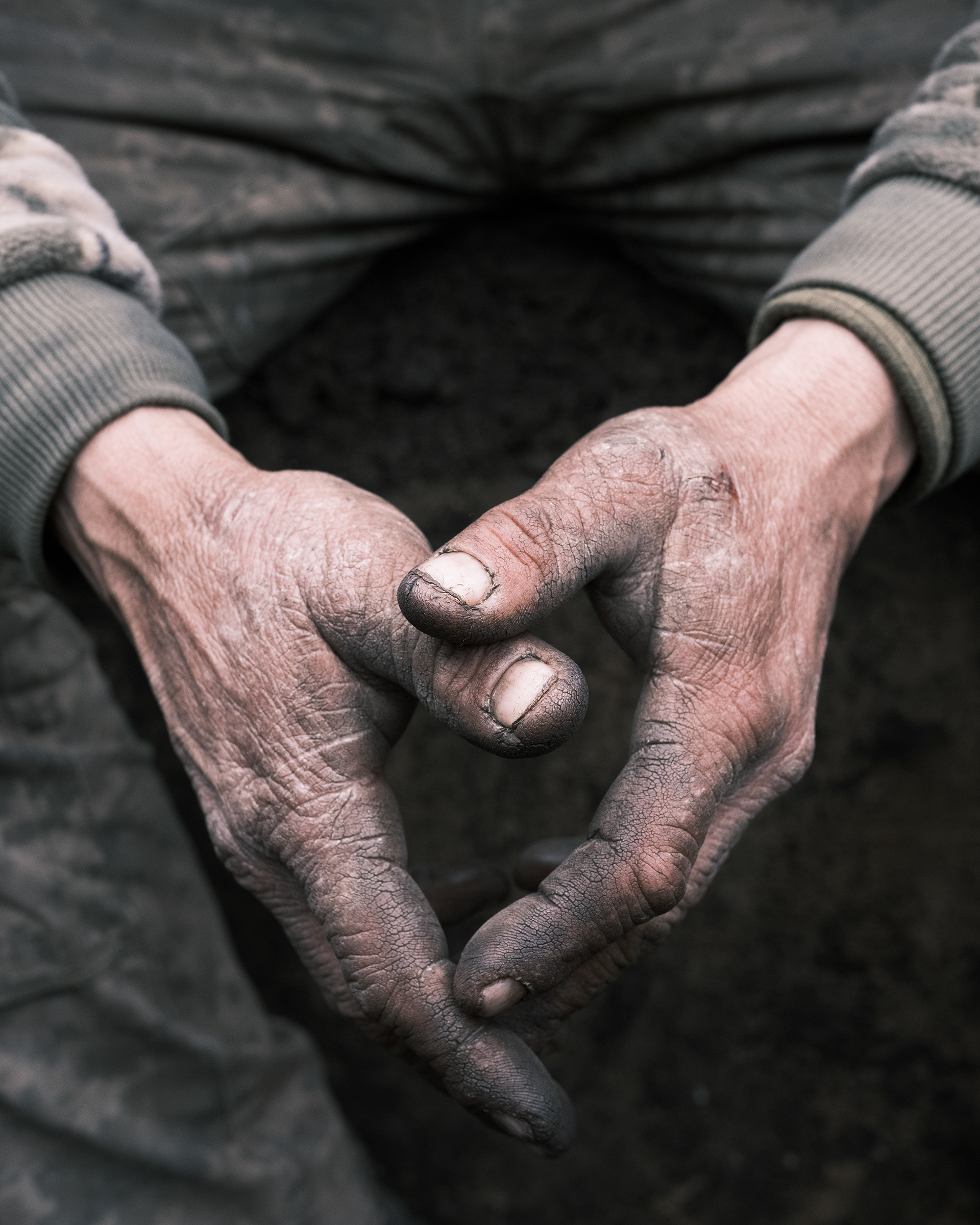 A Ukrainian soldier of the 28th Brigade, call sign Snowball, is digging a trench under fire at the outermost positions a few hundred meters from the enemy trenches, in Bakhmut on March 26. Due to the fact that they are far away from the place of supply a