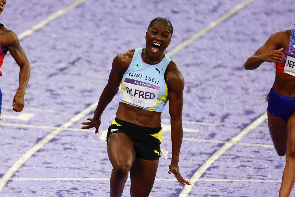 Julien Alfred of Saint Lucia wins Gold in the 100m Final during the Paris 2024 Olympic Games Athletics Women's 100m Finals  at the Stade de France on August 03, 2024 in Paris, France. 