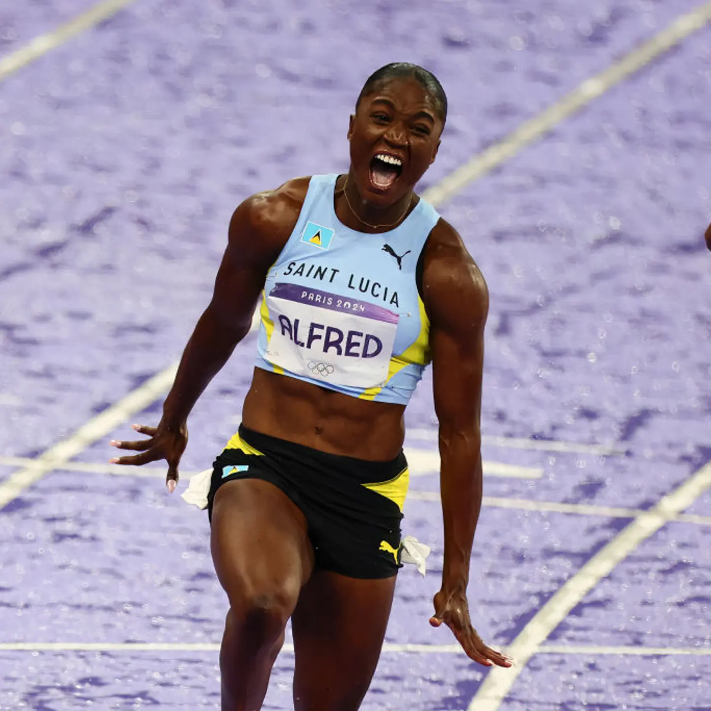 Julien Alfred of Saint Lucia wins Gold in the 100m Final during the Paris 2024 Olympic Games Athletics Women's 100m Finals at the Stade de France on August 03, 2024 in Paris, France.