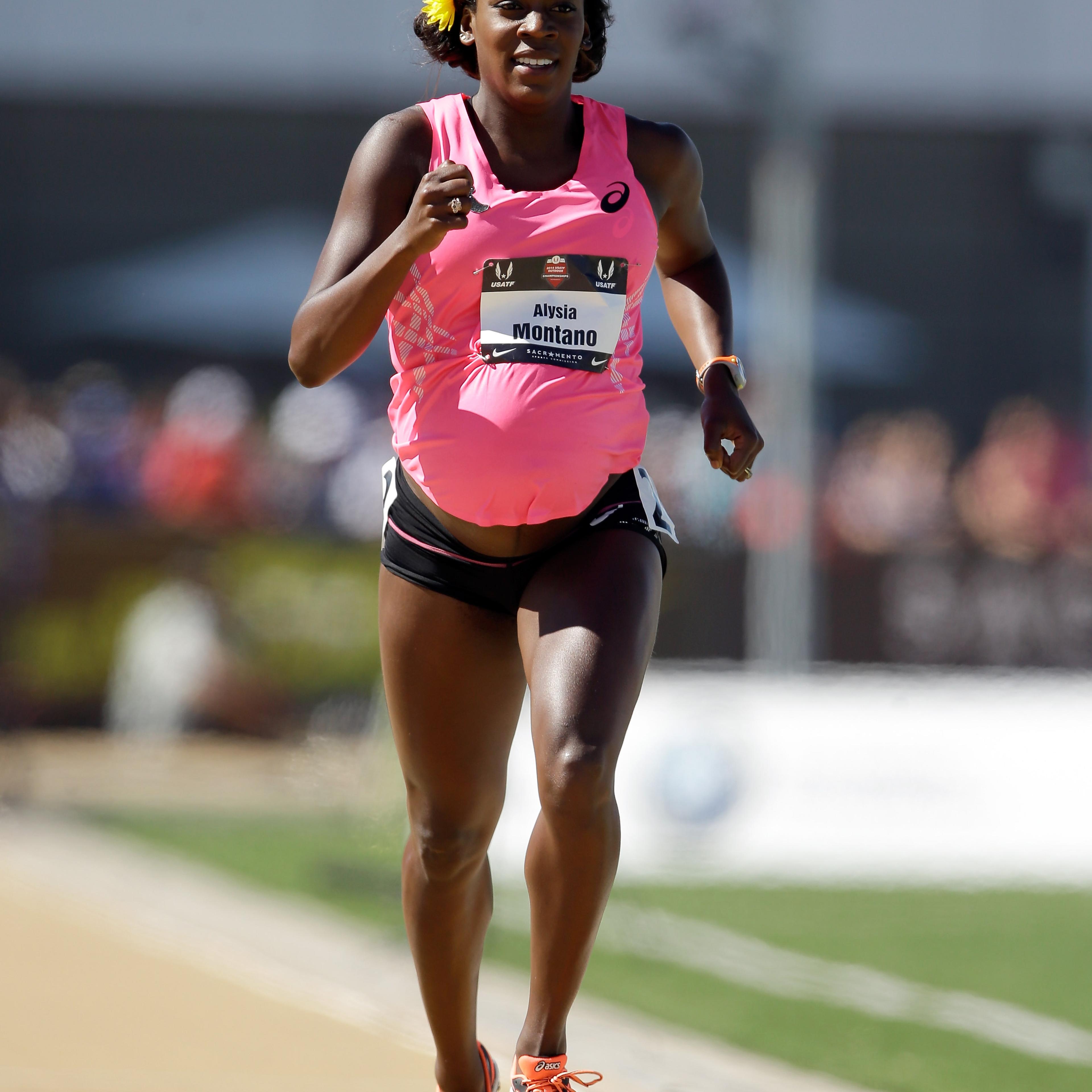 A pregnant Alysia Montano runs in the opening round of the women's 800 meter run during day 2 of the USATF Outdoor Championships at Hornet Stadium in Sacramento, California on on June 26, 2014.
