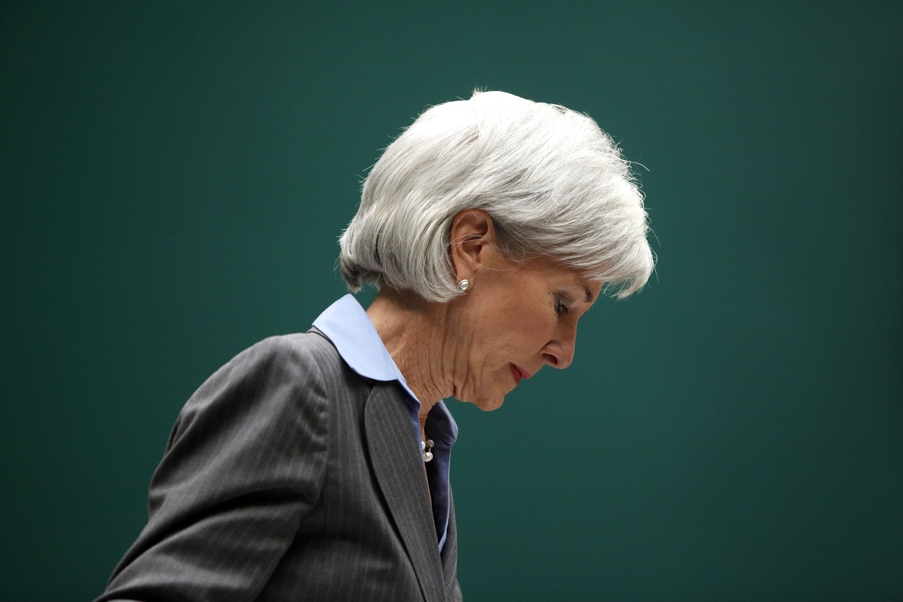 Health and Human Services Secretary Sebelius takes her seat to testify before a House Energy and Commerce Committee hearing about issues and complications with the Affordable Care Act enrollment website, on Capitol Hill