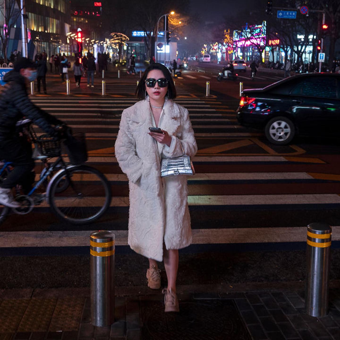 Woman walking in Beijing, China