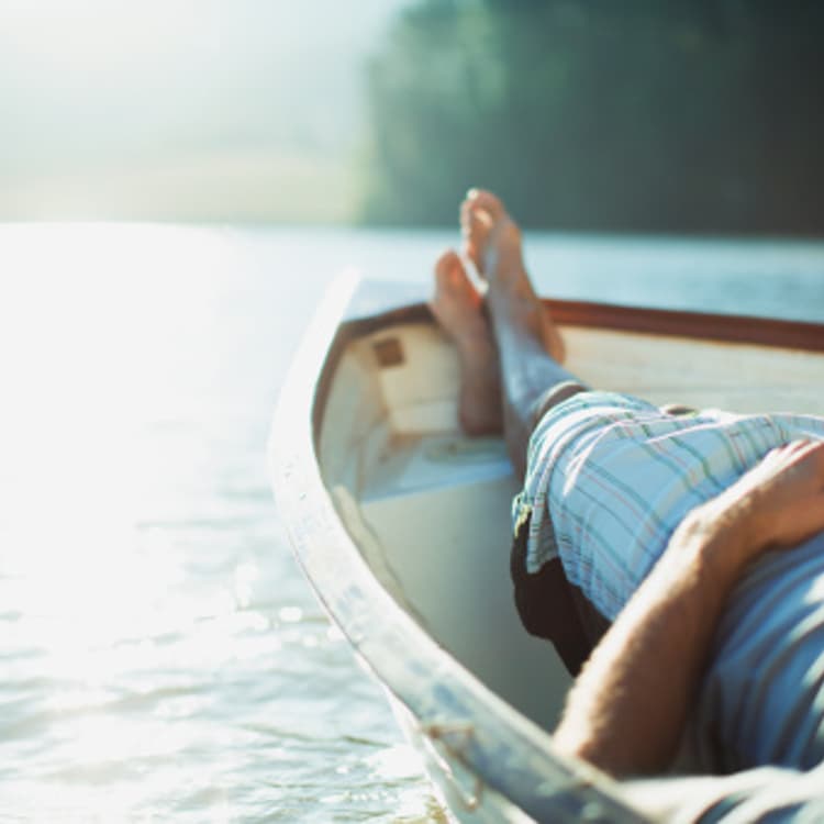 man-resting-rowboat