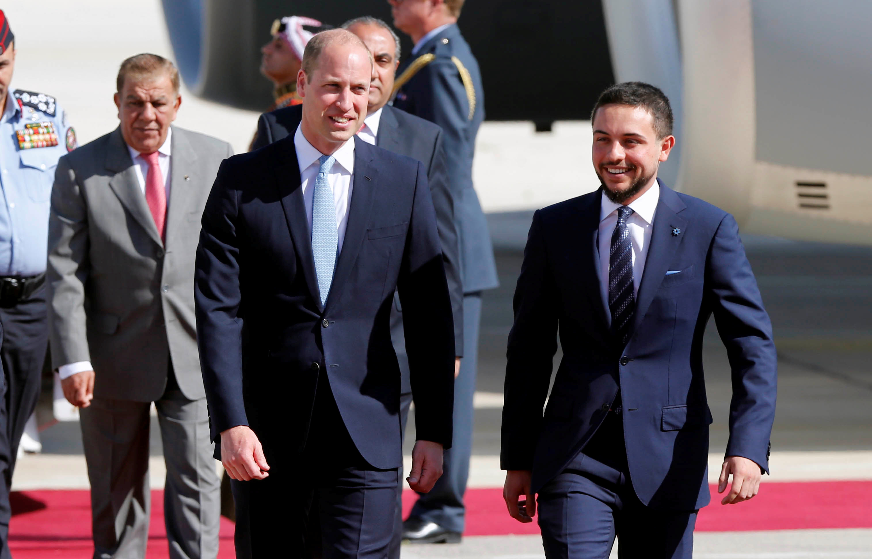 Britain's Prince William is welcomed by Jordan's Crown Prince Hussein bin Abdullah II in Amman