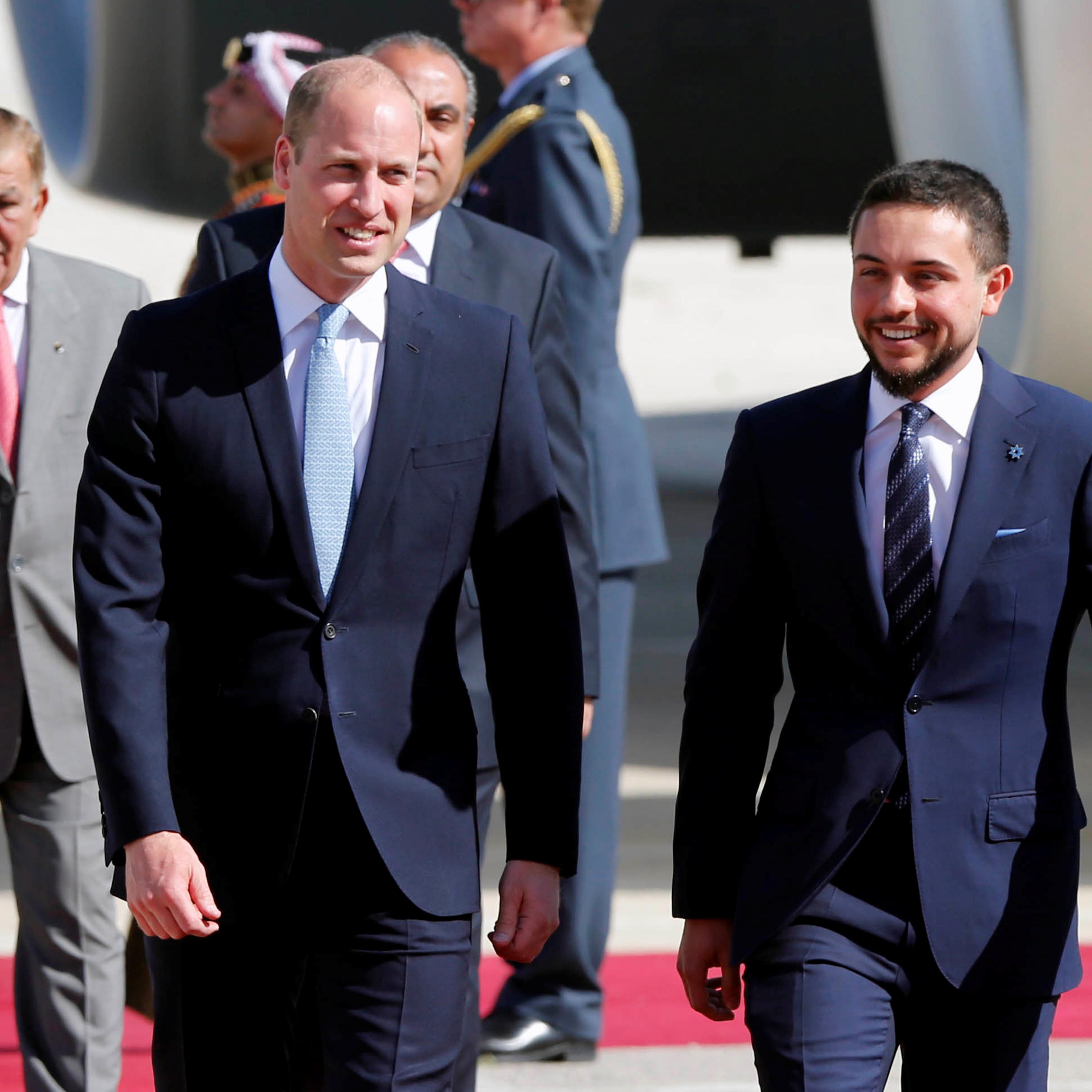 Britain's Prince William is welcomed by Jordan's Crown Prince Hussein bin Abdullah II in Amman