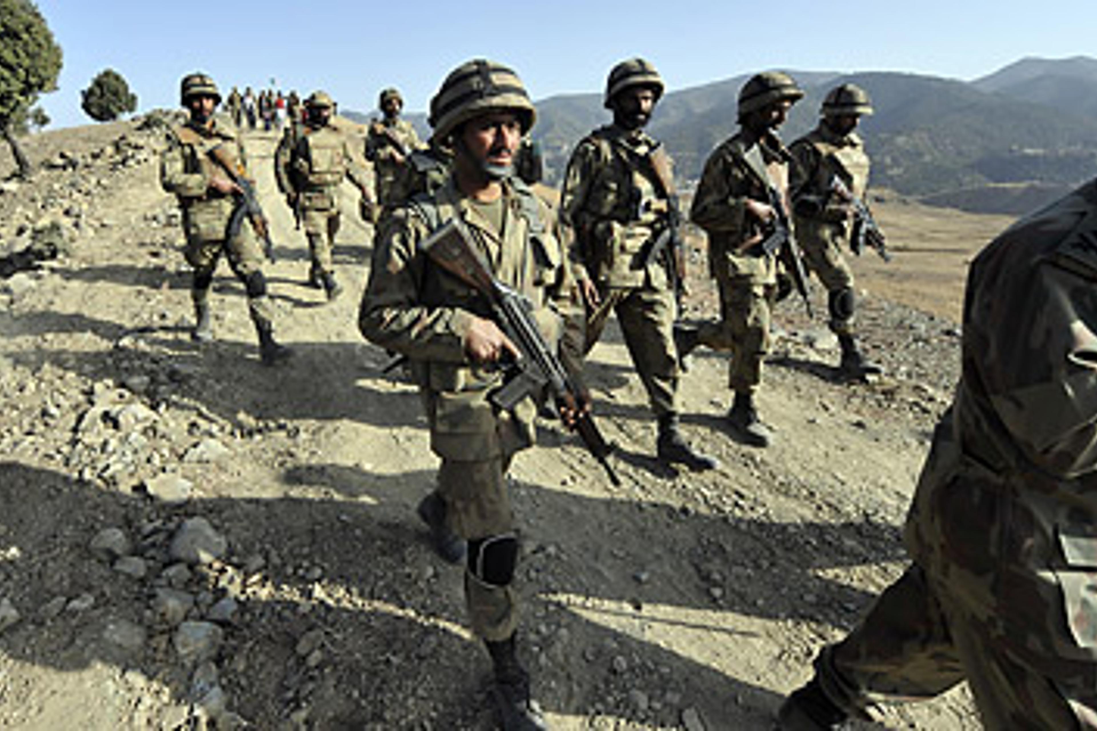 Pakistani troops patrol in South Waziristan along the Afghan border.