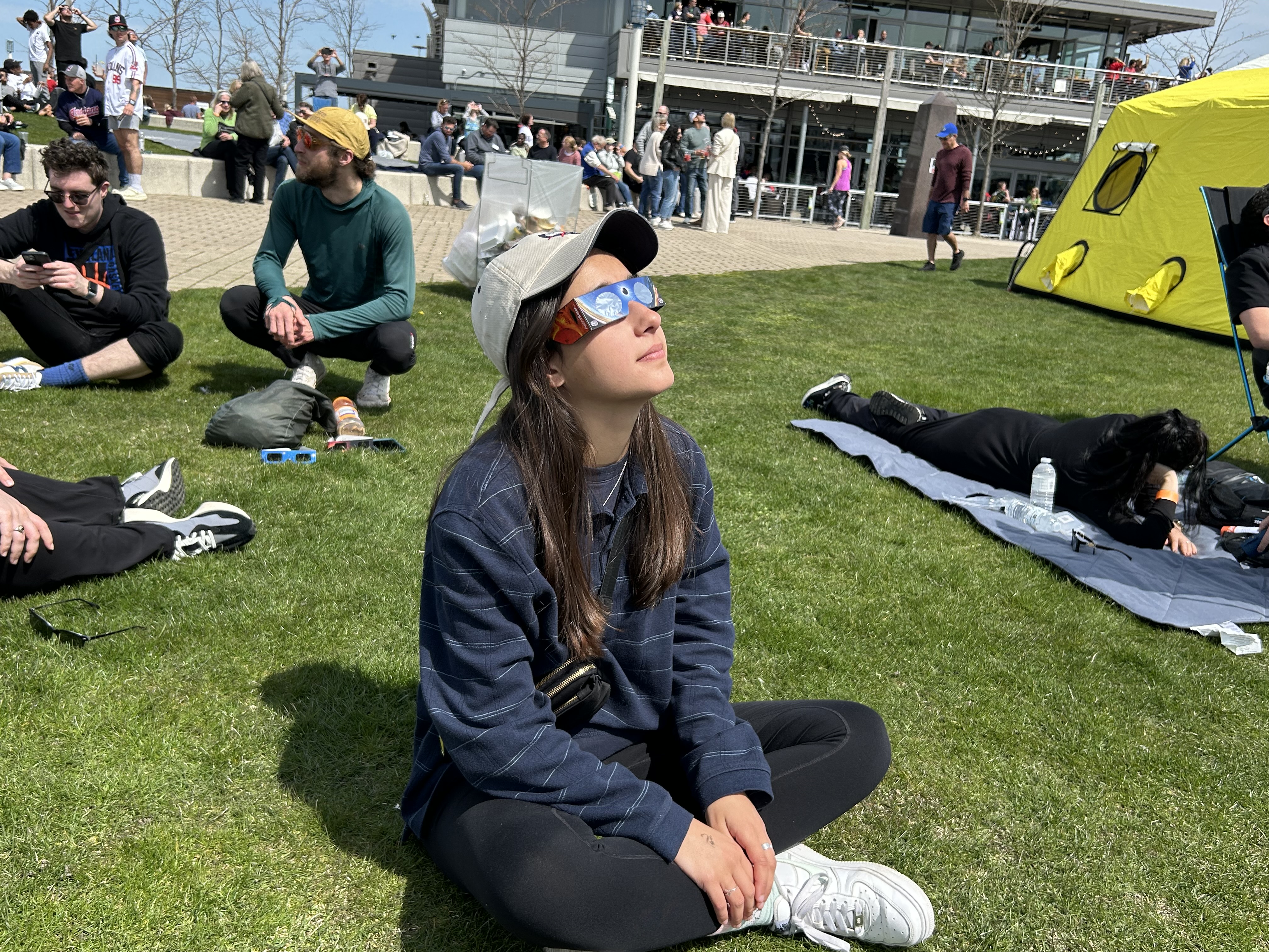Paloma Kluger, 21, watches the eclipse from the Great Lakes Science Center in Cleveland