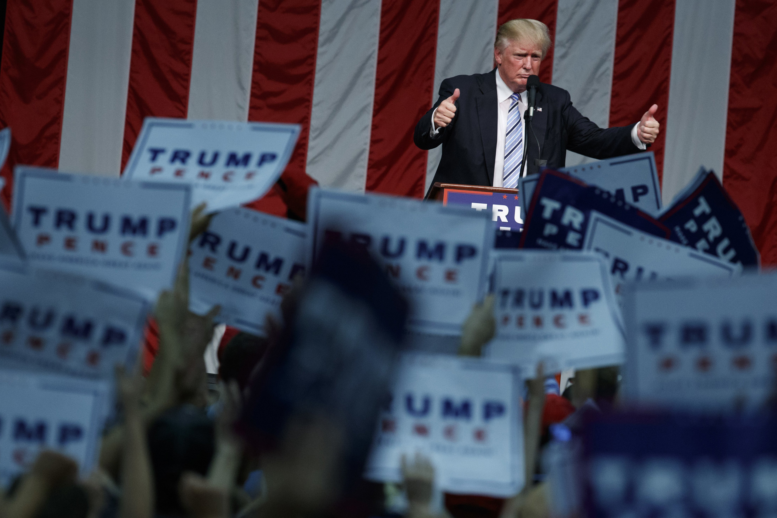 Republican presidential candidate Donald Trump gives a thumbs up after speaking during a campaign rally at Sacred Heart University in Fairfield, Conn. on Aug. 13, 2016.