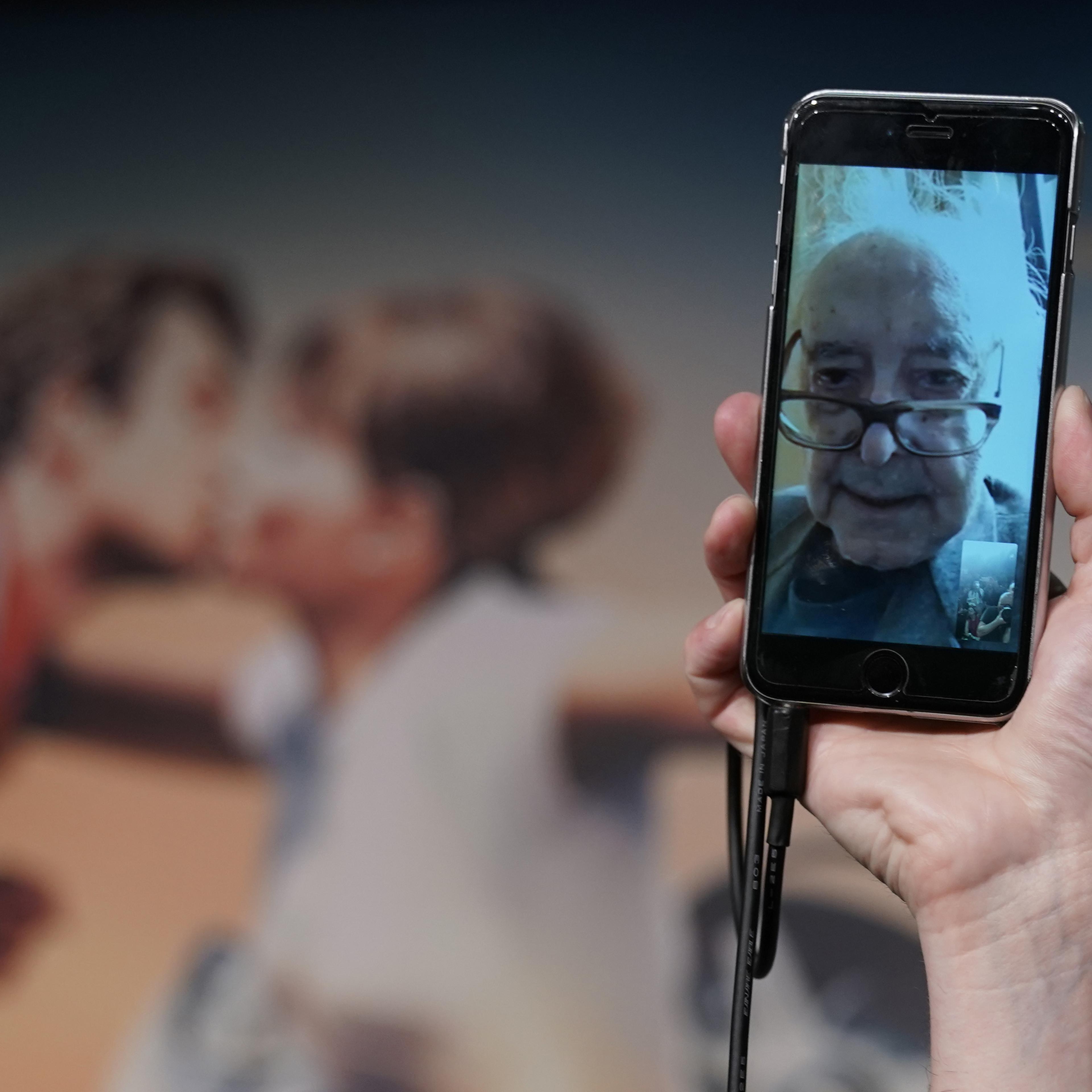 Director Jean-Luc Godard addresses a press conference through a mobile phone video link, from his home in Switzerland, on May 12, 2018 at the 71st Cannes Film Festival in southern France.