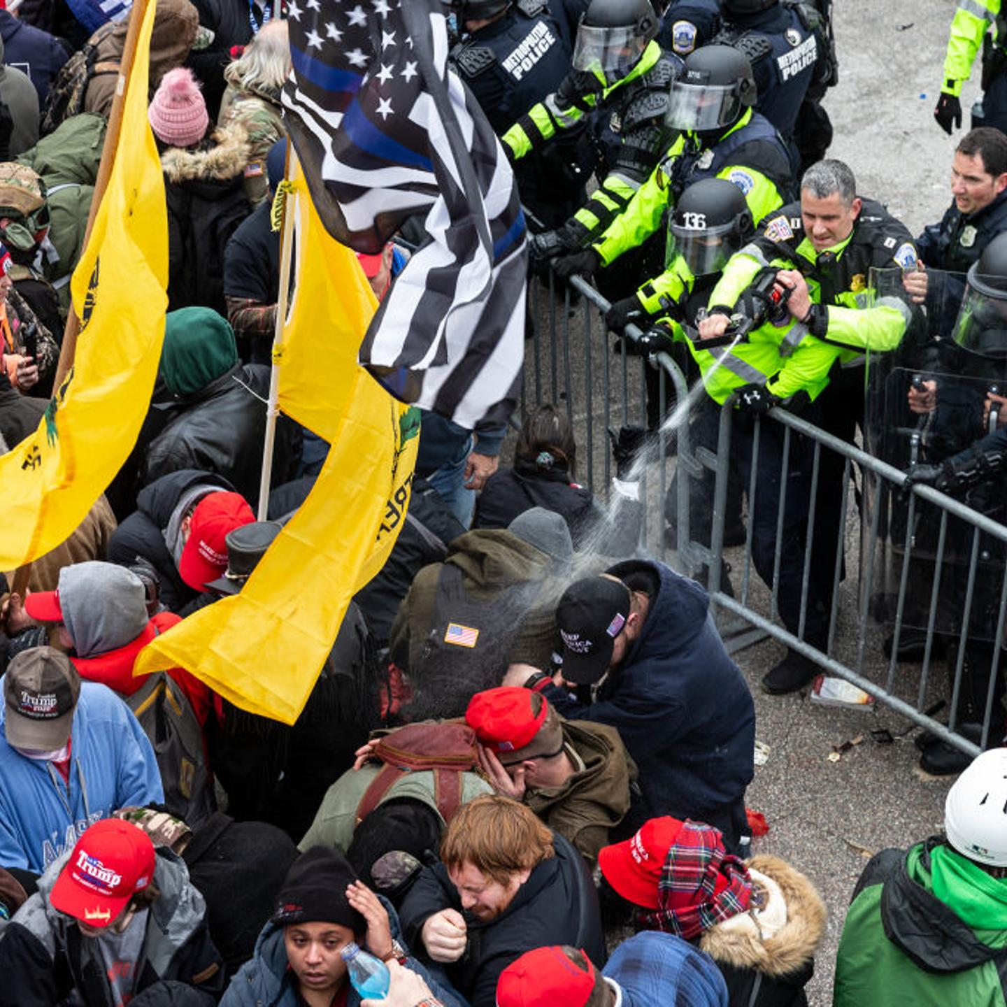 Pro-Trump protesters and police clash on top of the Capitol