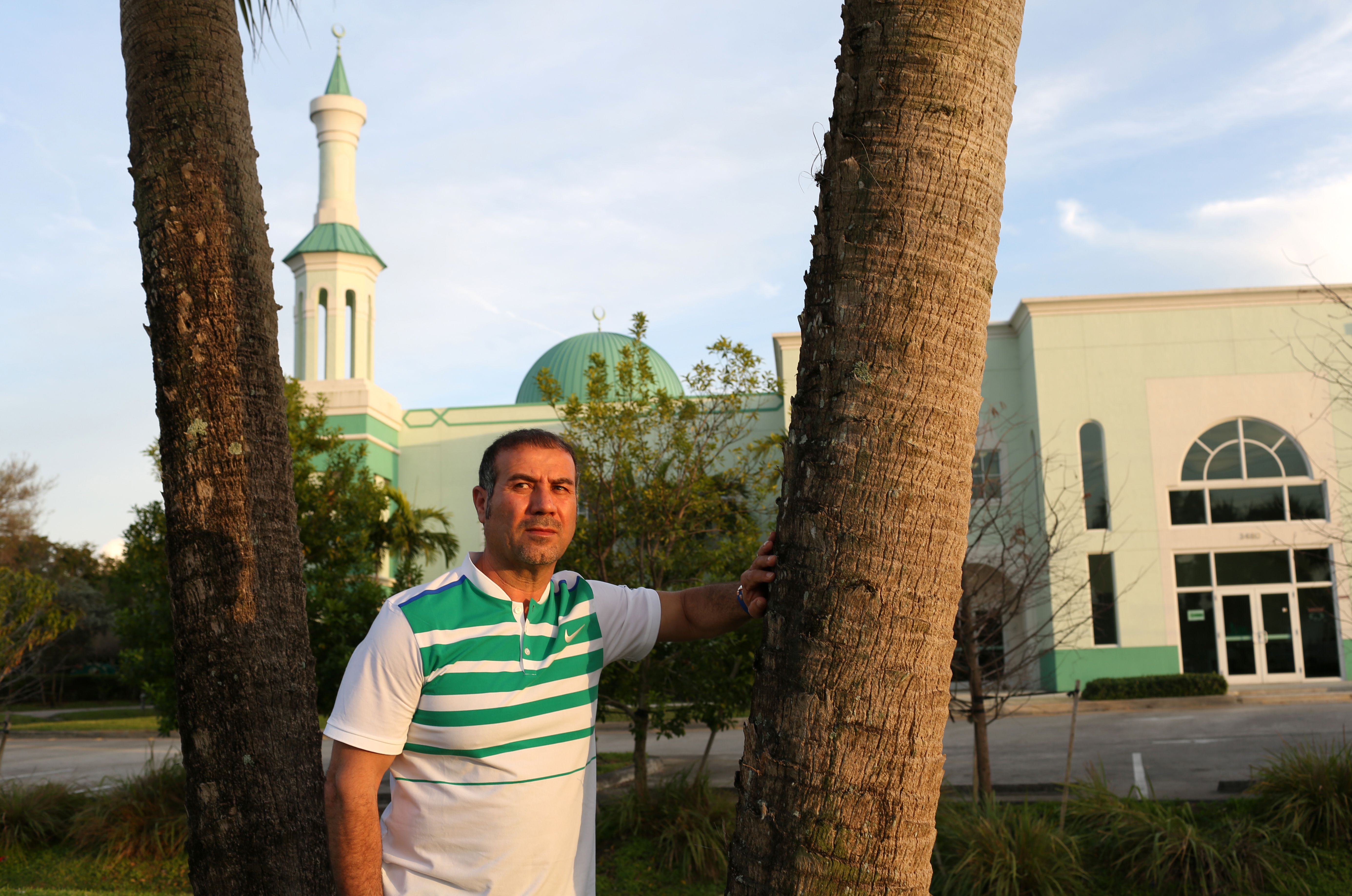 Omar Alkadri, 52, who immigrated from Syria in 1990 on a tourist visa, and gained citizenship through his check cashing business, poses for a portrait in front of the Islamic Center of Boca Raton, FL, on March 12, 2016. He says he was a four-time Democra