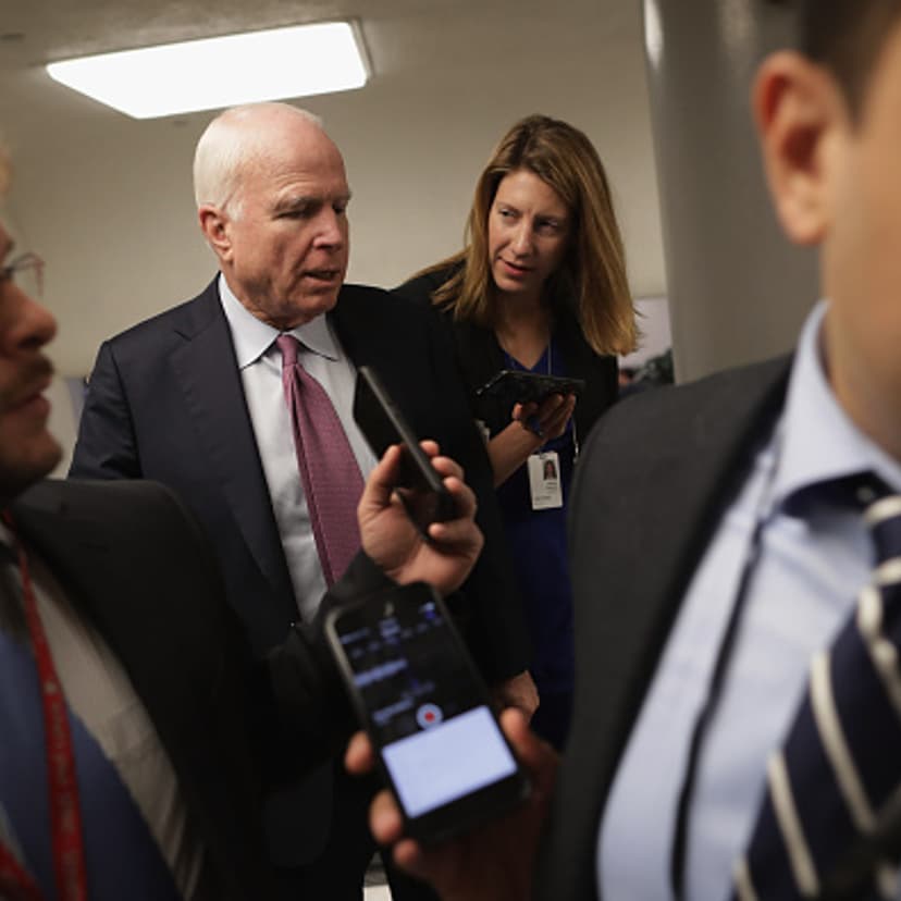 Sen. John McCain (R-AZ) talks with reporters while heading to the weekly Republican Democratic policy luncheon at the U.S. Capitol May 17, 2016 in Washington, DC.
