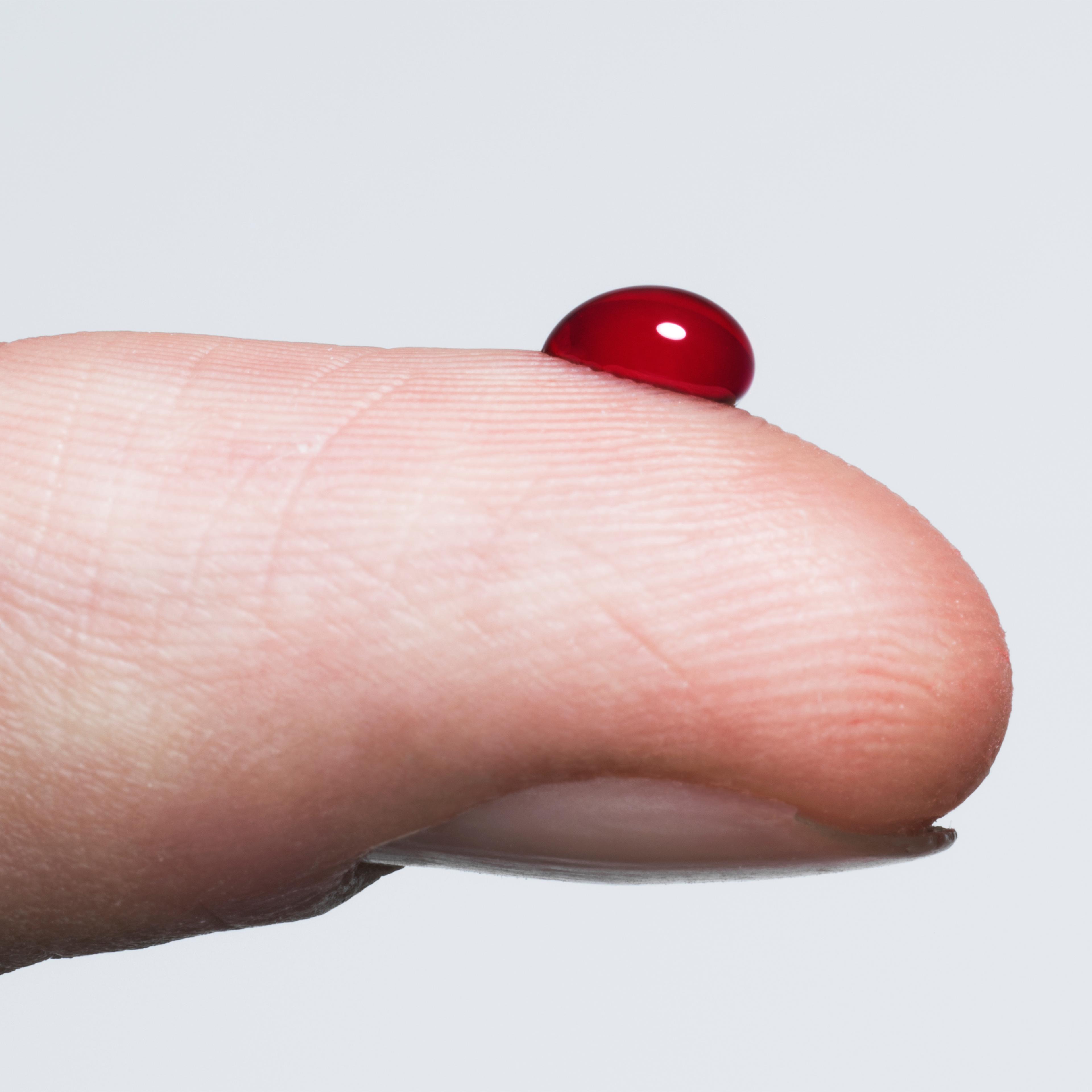 Finger with a bead of blood