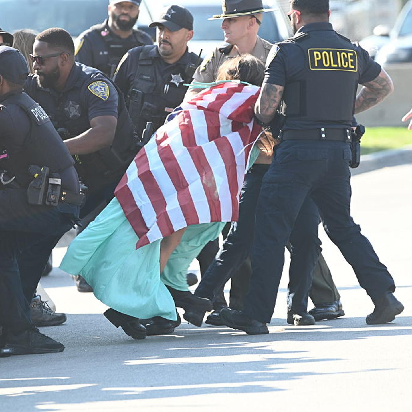 Police detain protesters during rally in front of the ICE building in Illinois