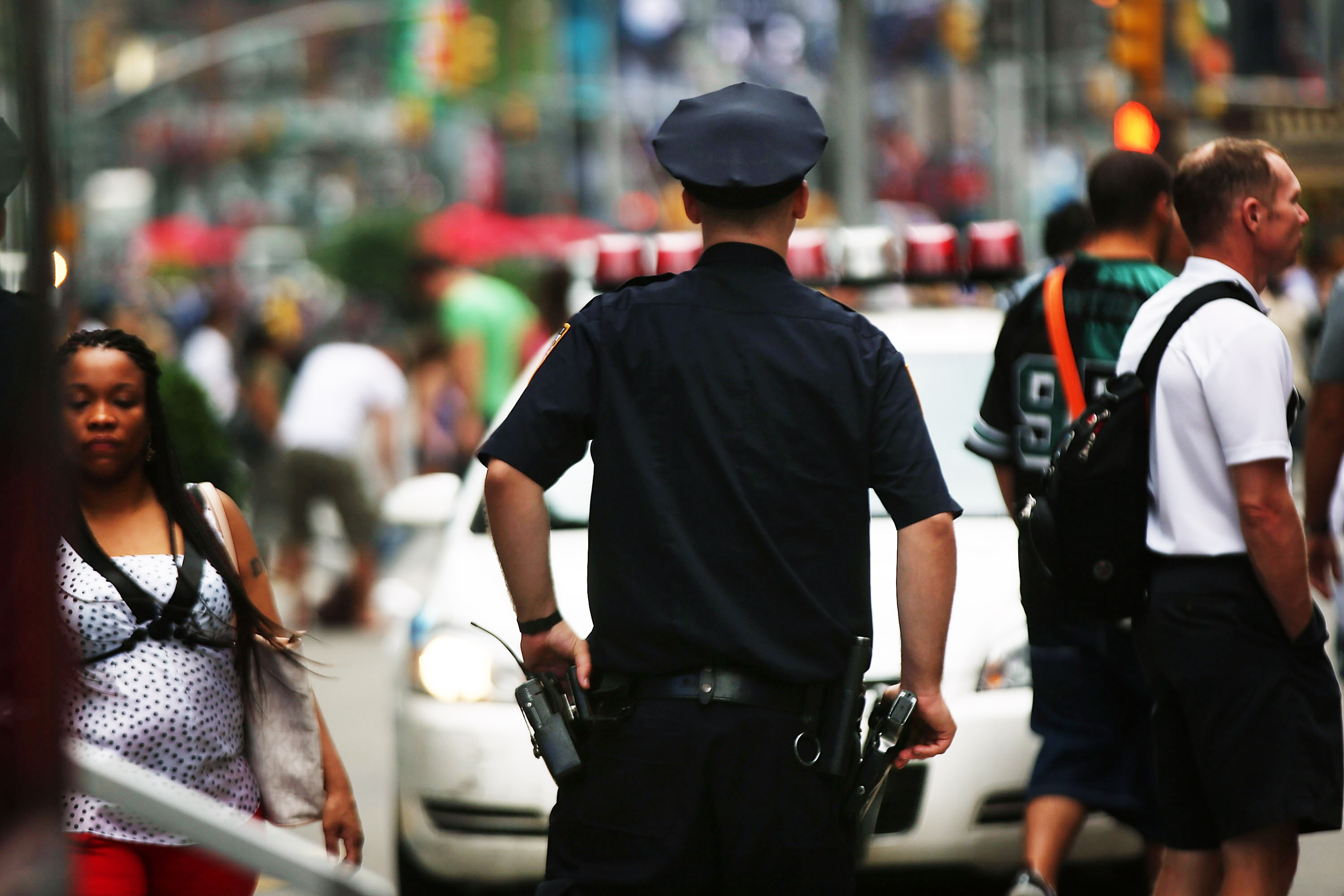 A New York City police officer stands in Times Square on Aug. 12, 2013 in New York City.