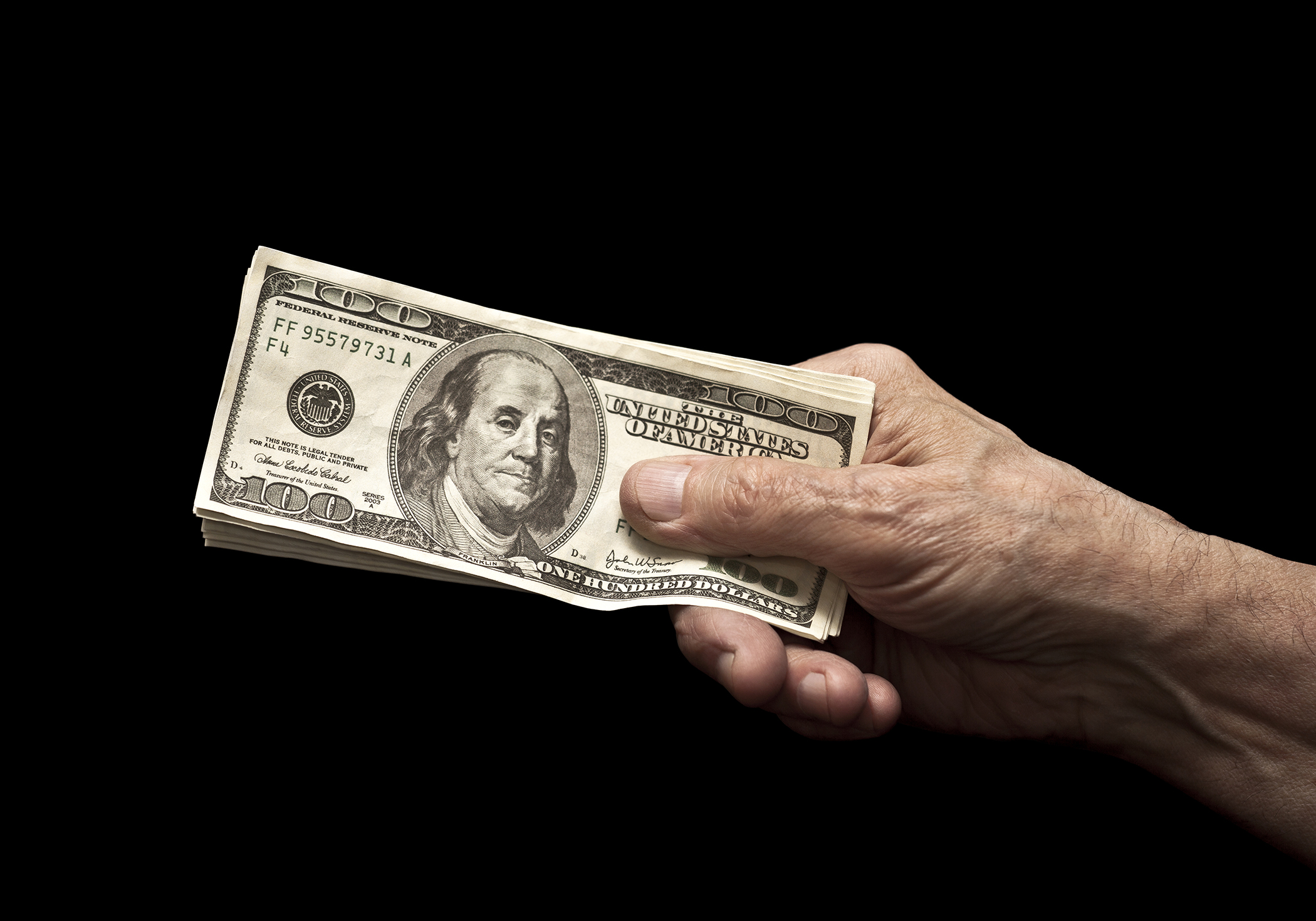 Stack of bills in a hand