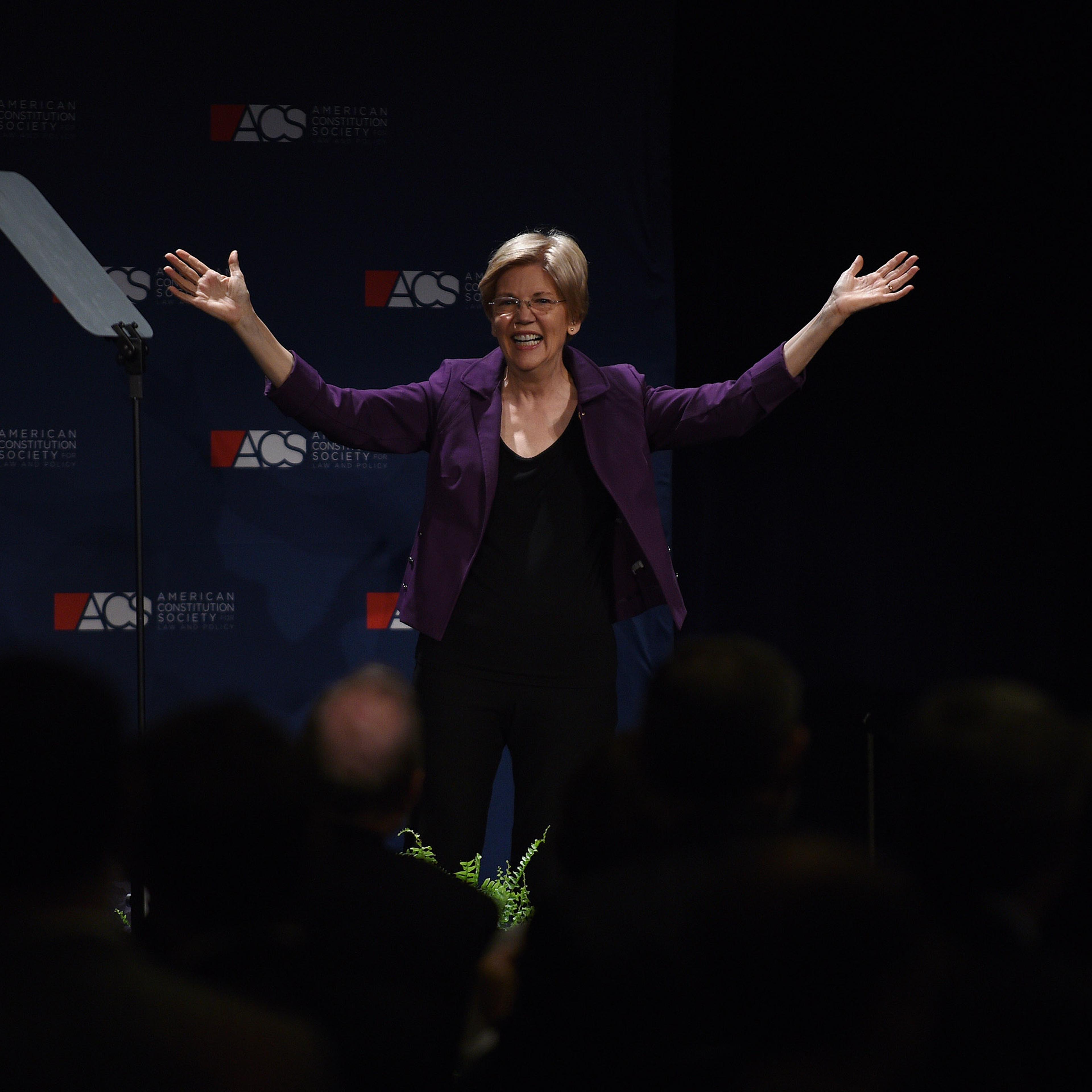 Sen. Elizabeth Warren (D-Mass.) raises her arms after addressing the American Constitution Society 2016 National Convention on June 9, 2016 in Washington, DC. The senator attended the gala dinner of the convention at the Capital Hilton.