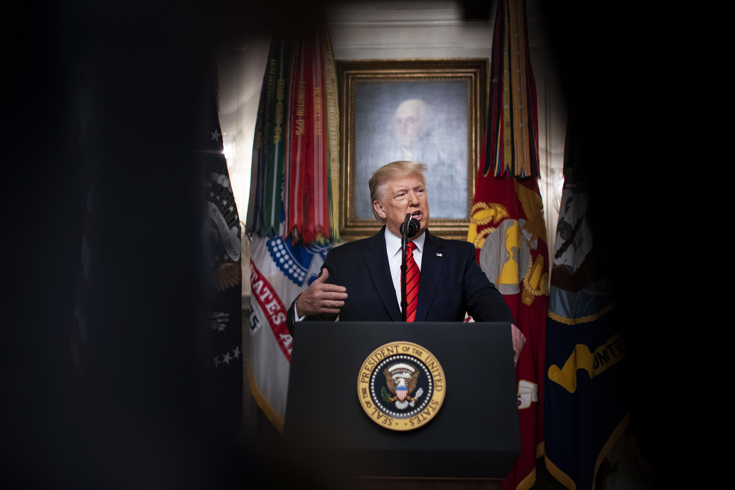 President Donald Trump speaks during the announcement of a commando raid in the Diplomatic Reception Room of the White House in Washington, Oct. 27, 2019