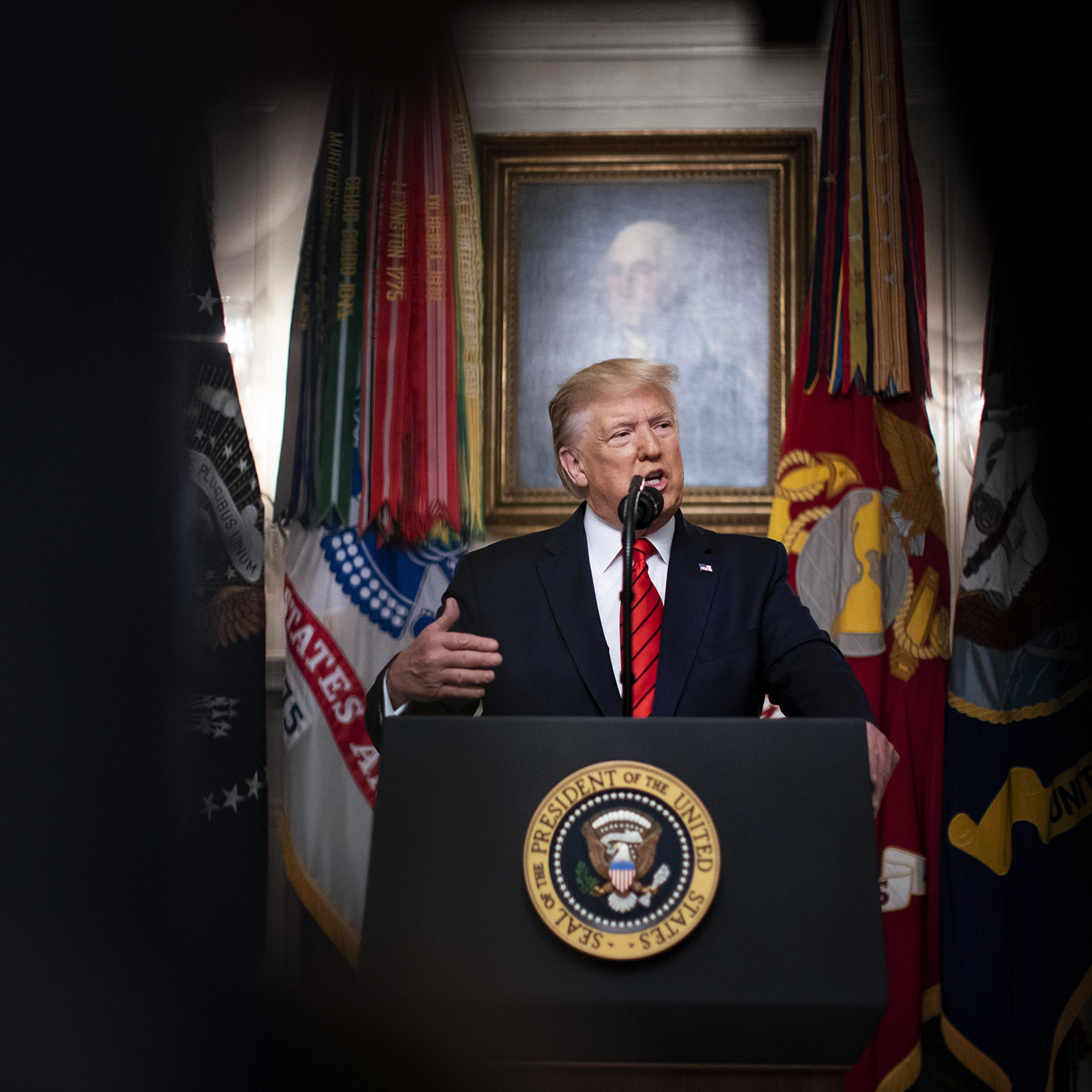 President Donald Trump speaks during the announcement of a commando raid in the Diplomatic Reception Room of the White House in Washington, Oct. 27, 2019