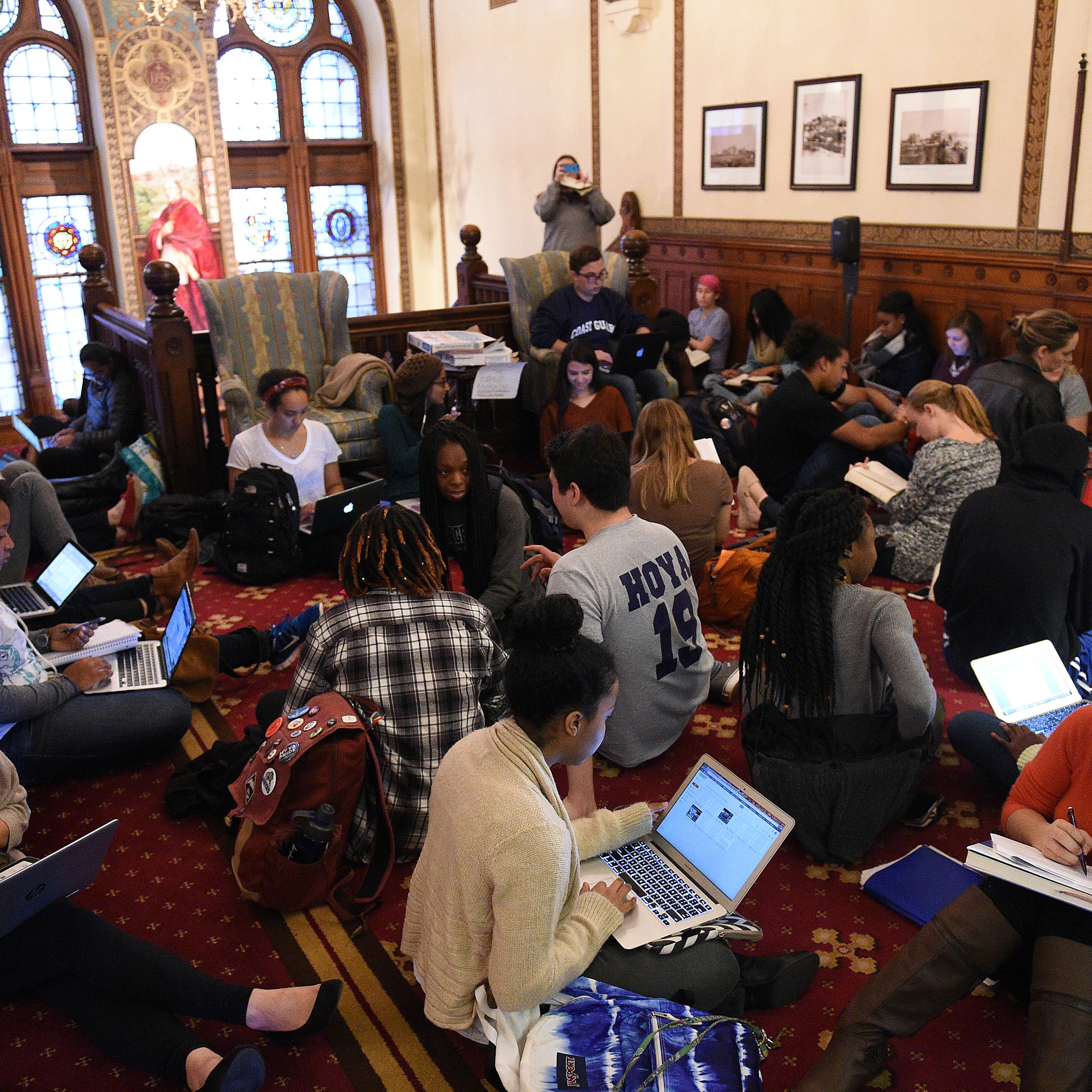 Around 30 students sit in in front of the office of John J. DeGioia, president of Georgetown University in Washington D.C. on Nov. 13, 2015. The sit in was in solidarity with other student protests throughout the country addressing racial discrimination