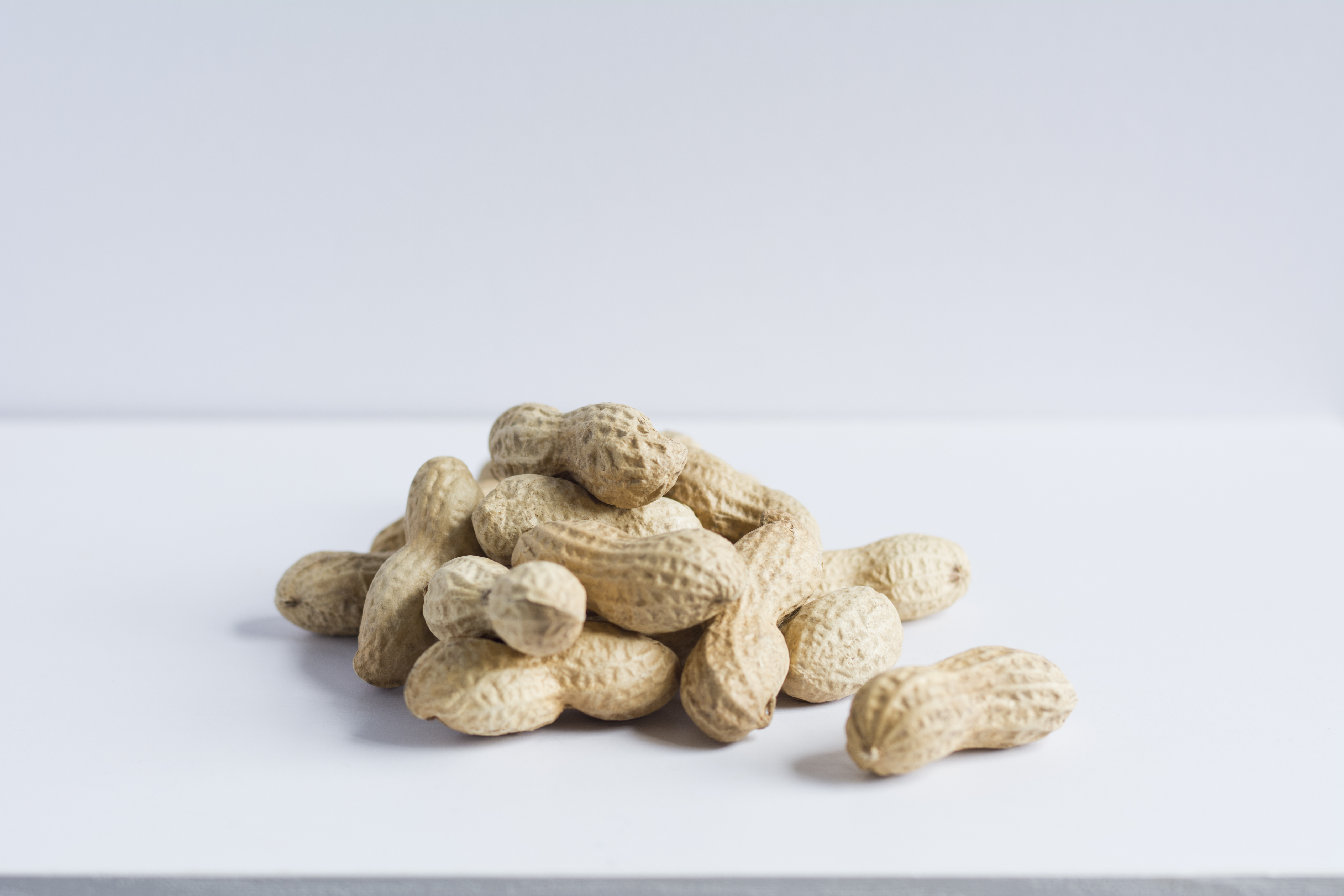 Pile of whole peanuts in shell