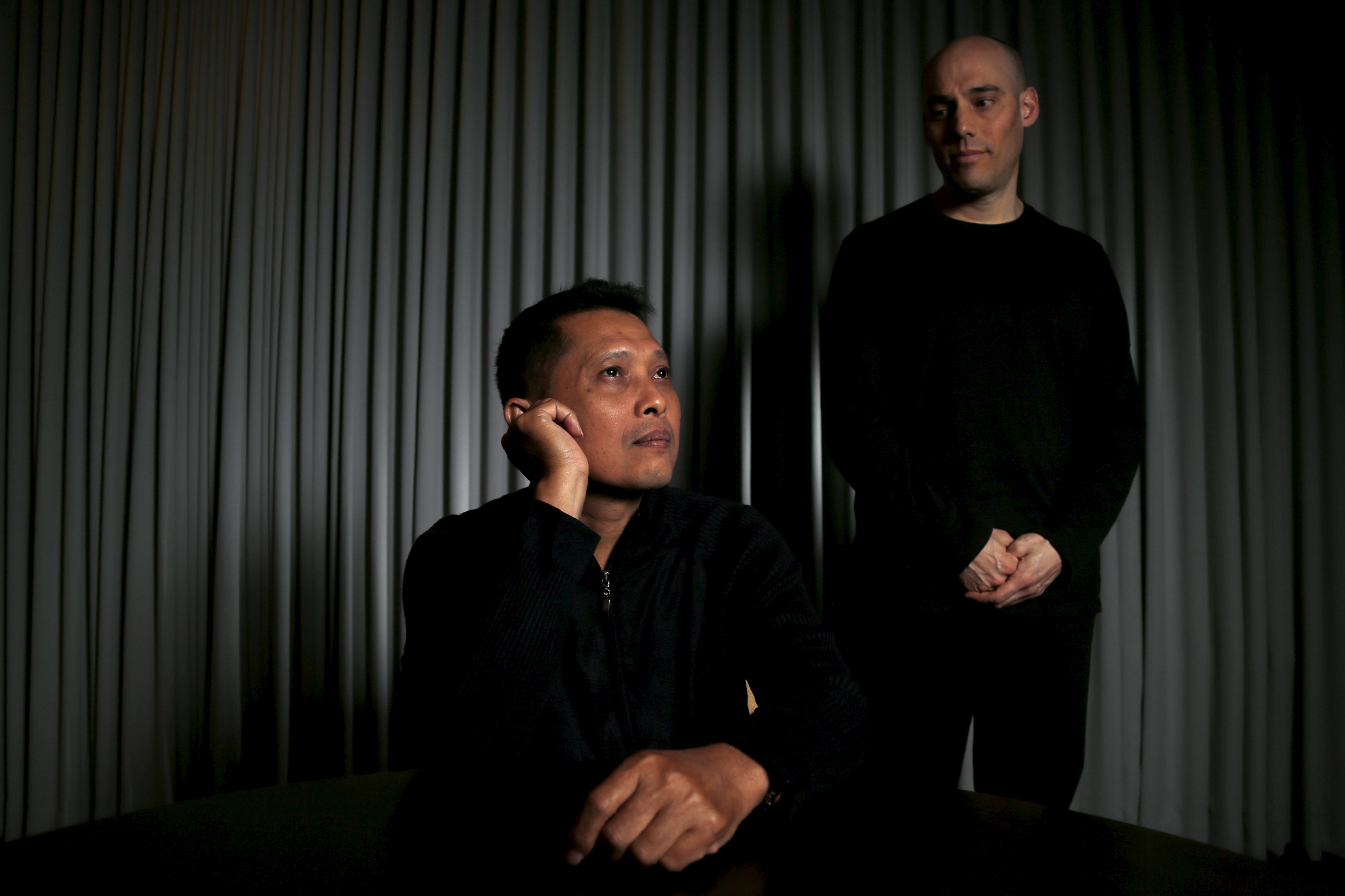 Joshua Oppenheimer, director of the documentary "The Look of Silence", and Adi Rukun, who is featured in the documentary, pose for a portrait in Beverly Hills