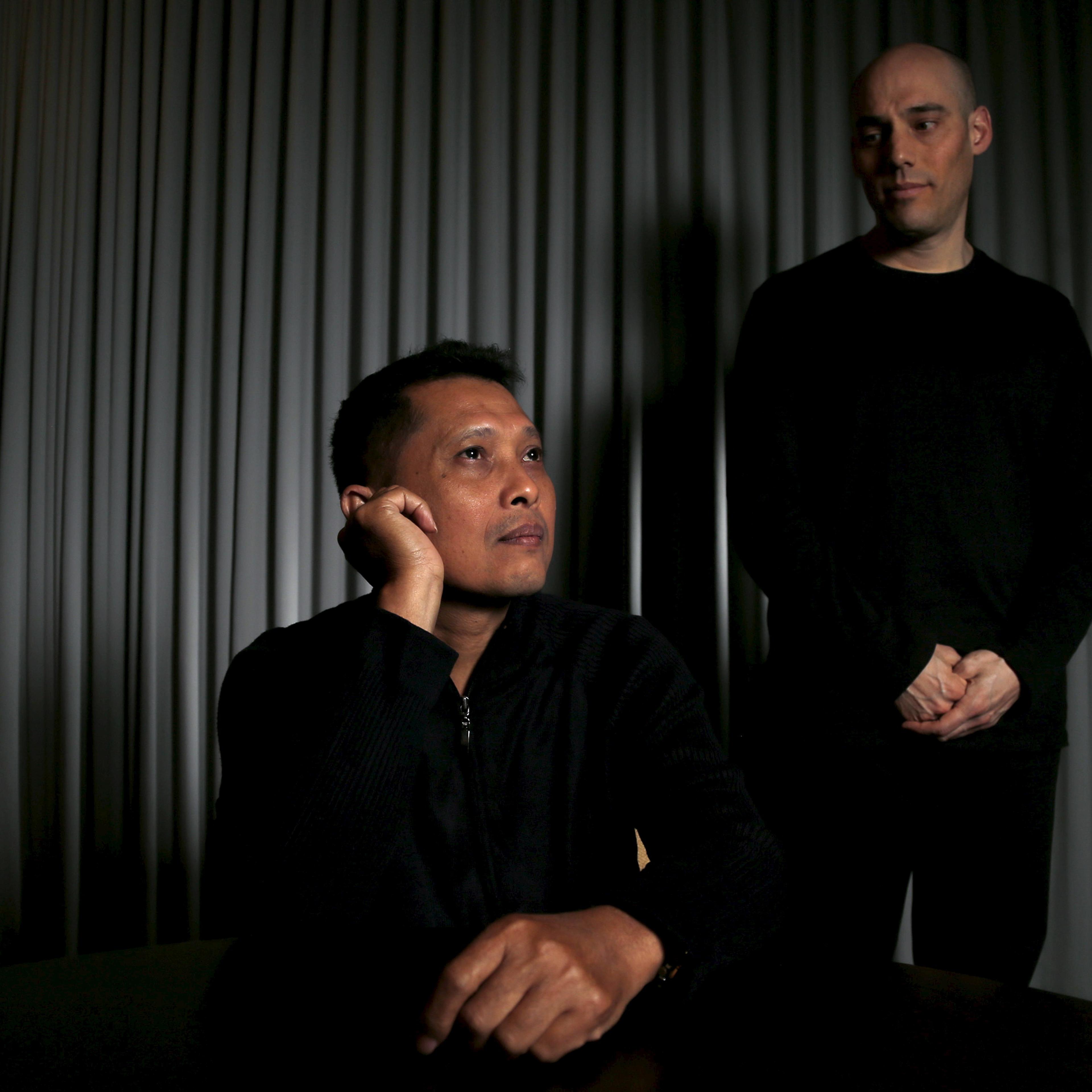 Joshua Oppenheimer, director of the documentary "The Look of Silence", and Adi Rukun, who is featured in the documentary, pose for a portrait in Beverly Hills