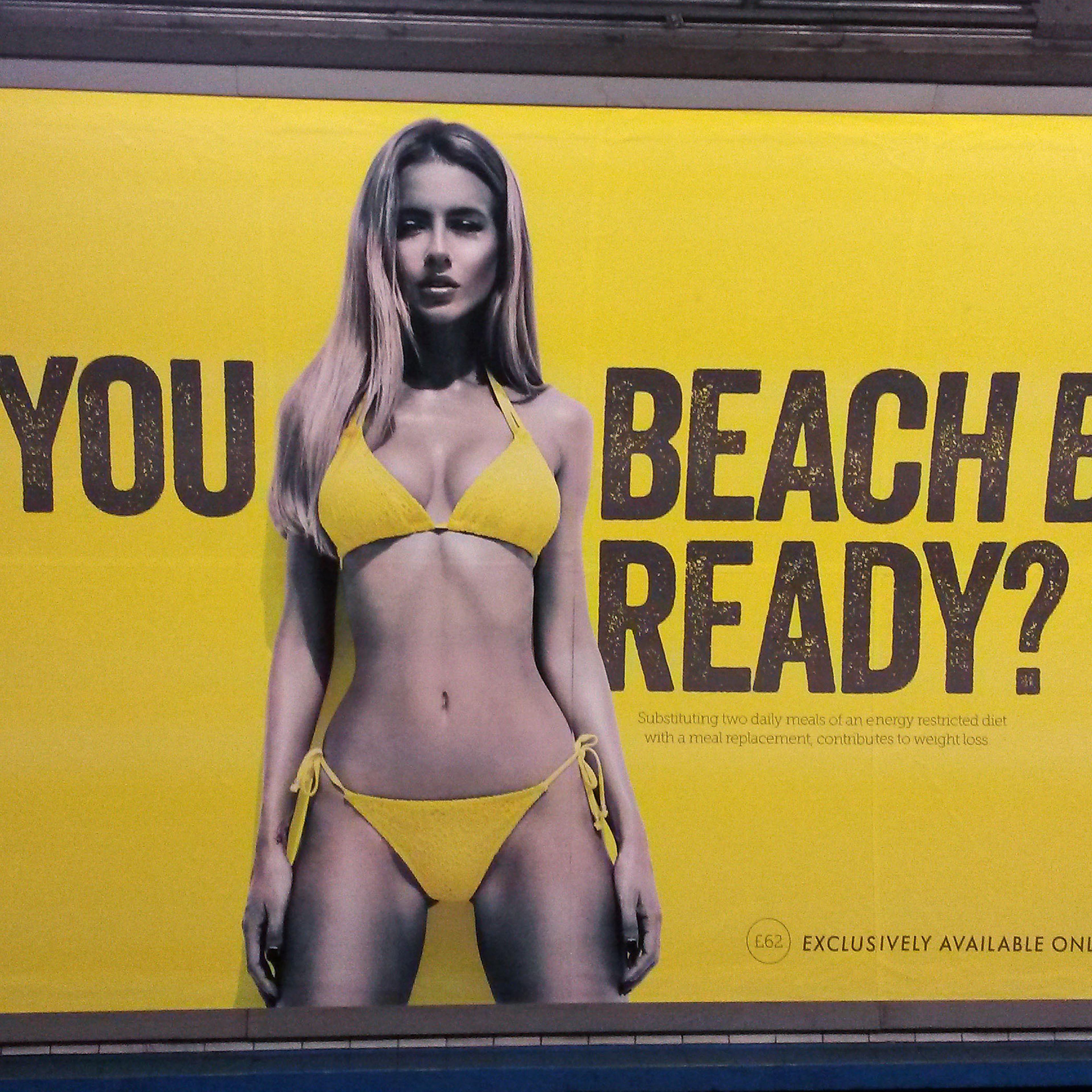 a Protein World advert displayed in an underground station in London which says "Are you beach body ready?" as a petition calling for its removal gathers tens of thousands of signatures.