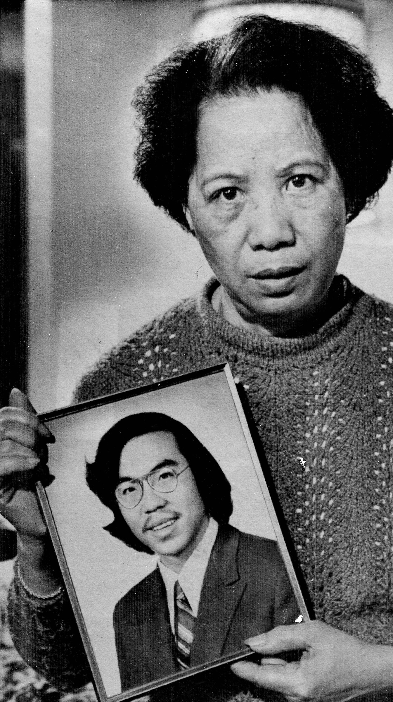 Lily Chin holds a photograph of her son Vincent, 27, who was beaten to death on June 23, 1982, in a photo made Nov. 2, 1983. A federal grand jury returned a criminal indictment on federal civil rights charges against two white East Detroit men who were p