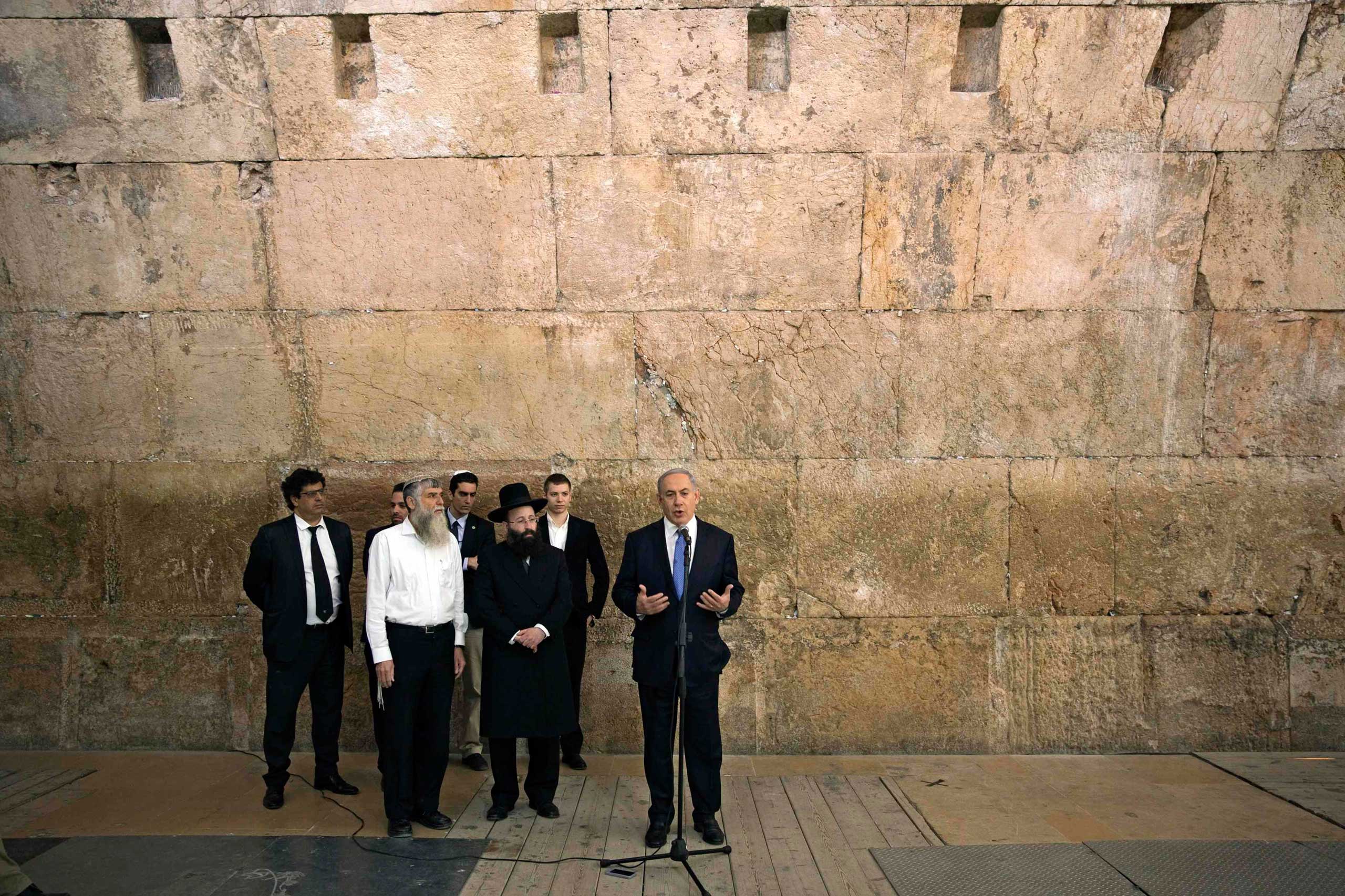 Israel's Prime Minister Benjamin Netanyahu gives a statement to the media in front of the Western Wall, in Jerusalem's Old City, March 18, 2015.