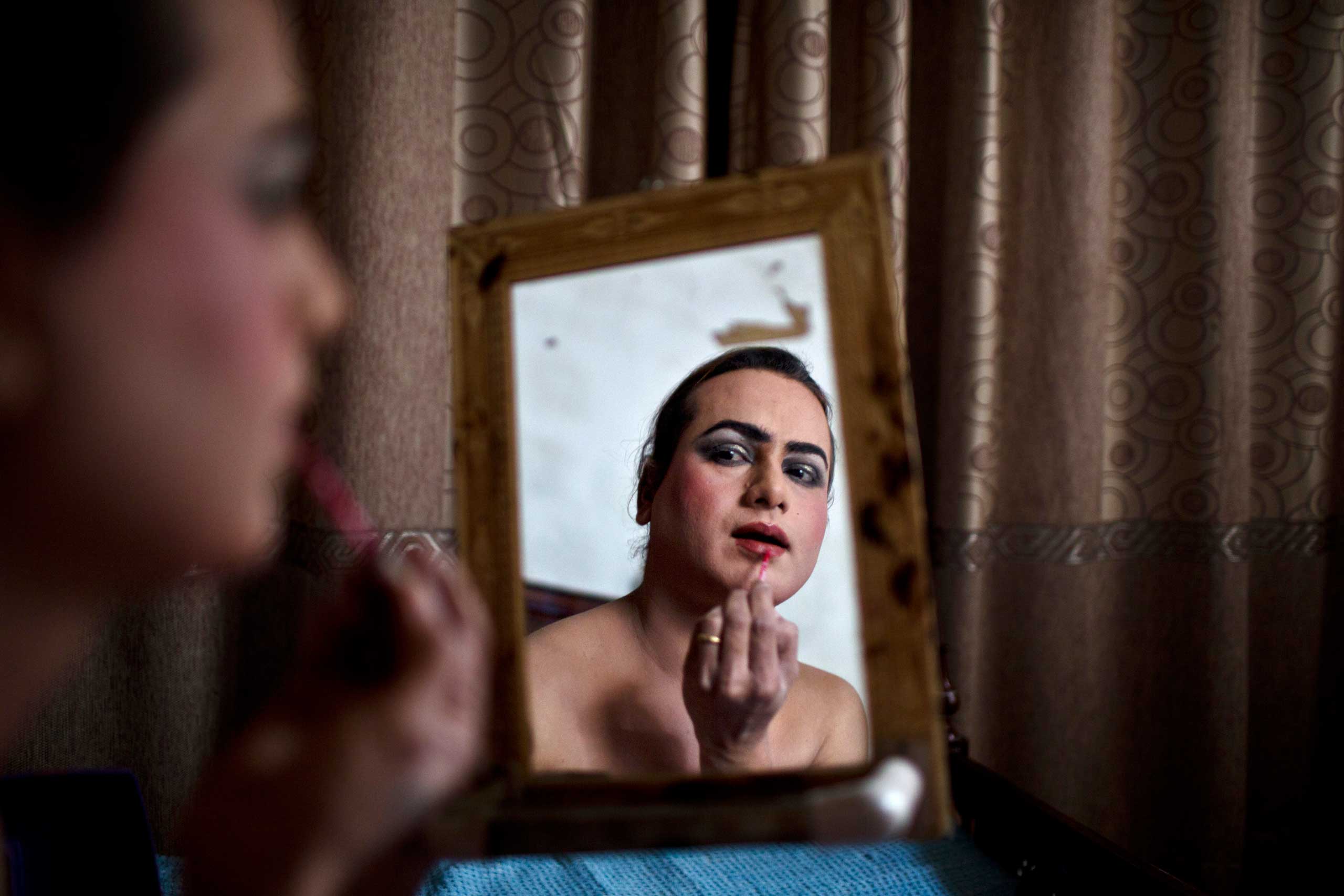 The Washington Post In Sight: Leading a Double Life in PakistanWaseem Akram, 27, applies makeup on his face as he prepares himself for a party at a friend's place in Rawalpindi, Pakistan, Jan. 10, 2015.