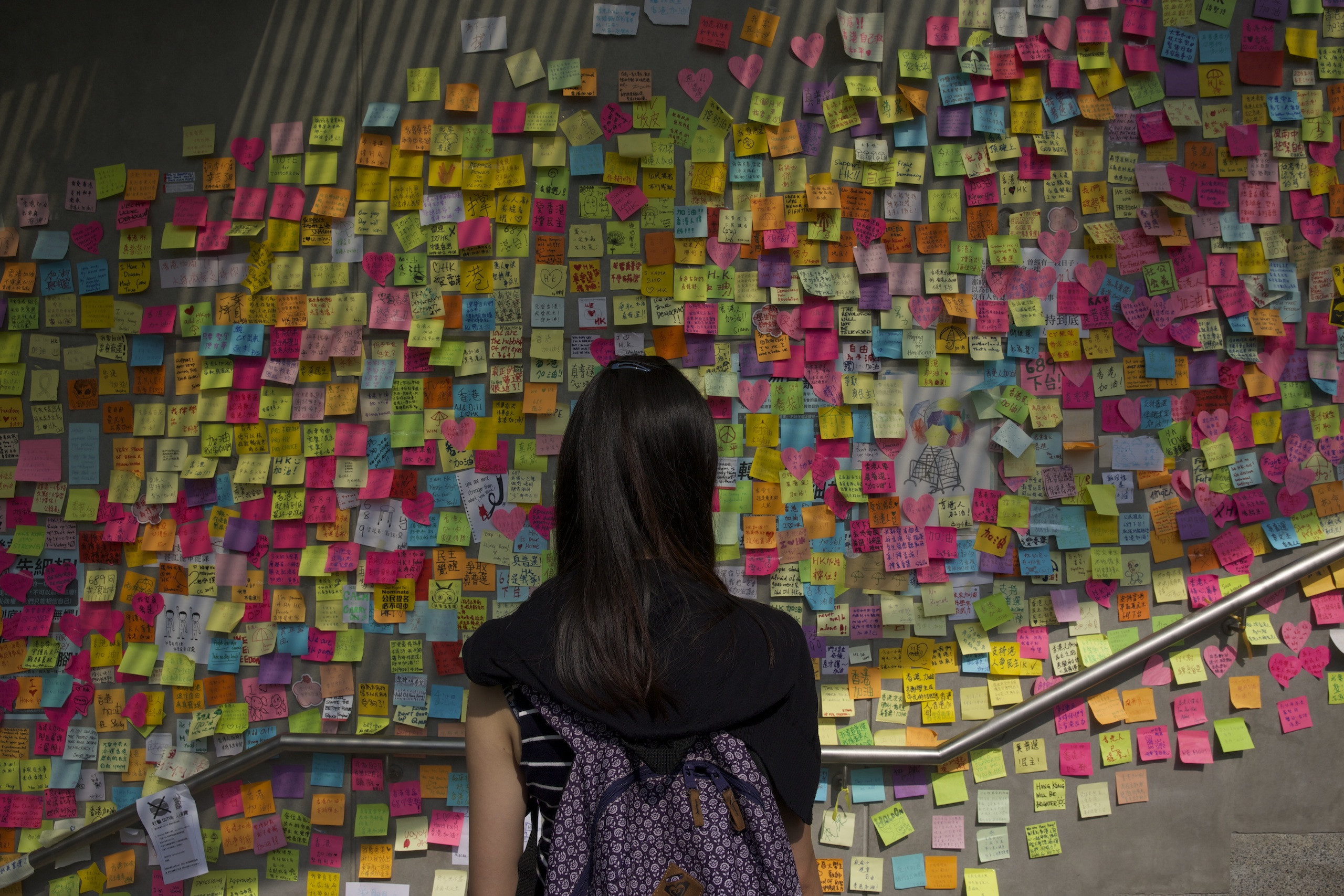 Democracy demonstrations in Hong Kong. Students and pro-democracy citizens being attacked and shouted at by anti-demonstration group in Mongkok. Pro-police rally. Joshua Wong, 17-year-old protest leader.by James Nachtwey