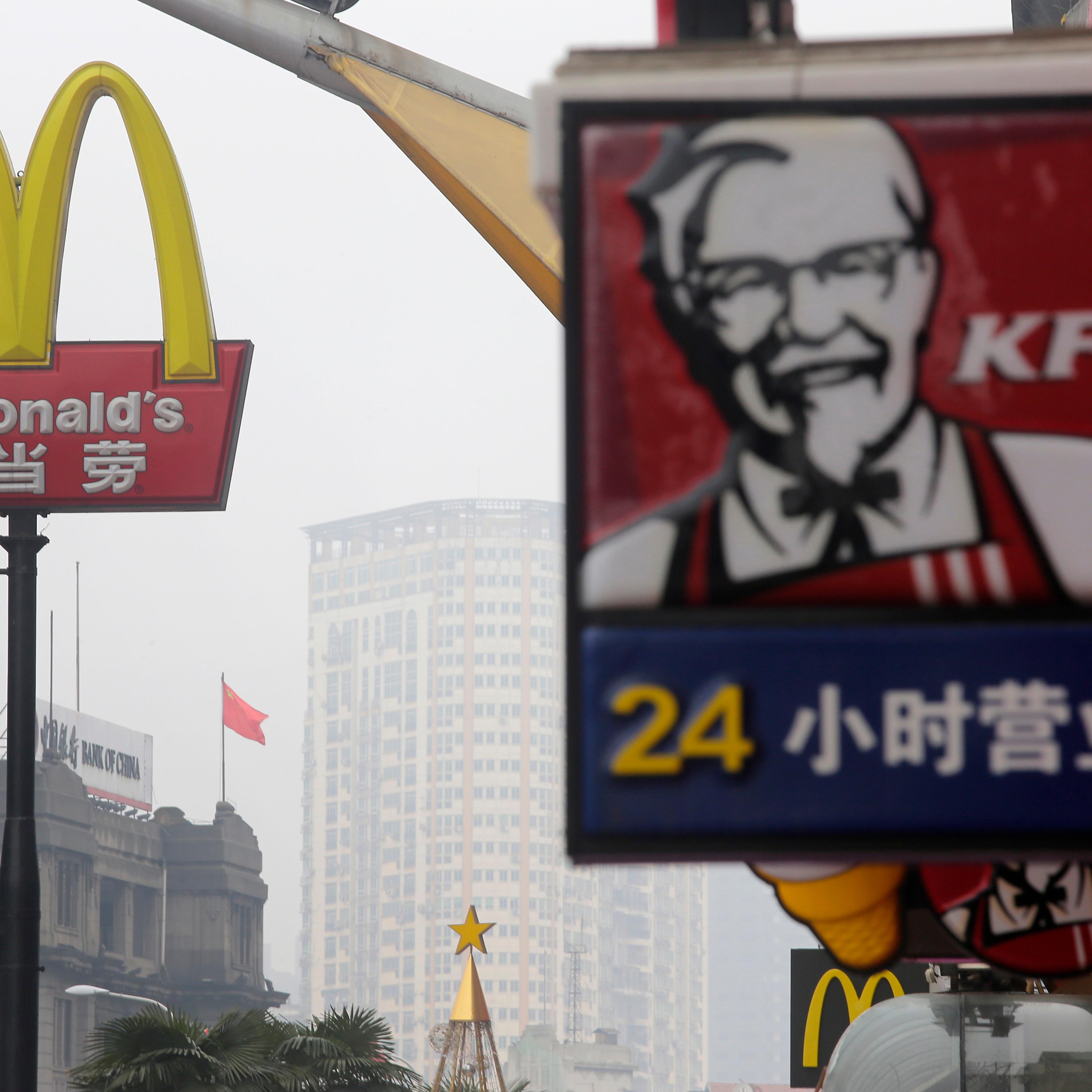 A McDonald's logo is seen next to a logo of KFC in Wuhan, Hubei province