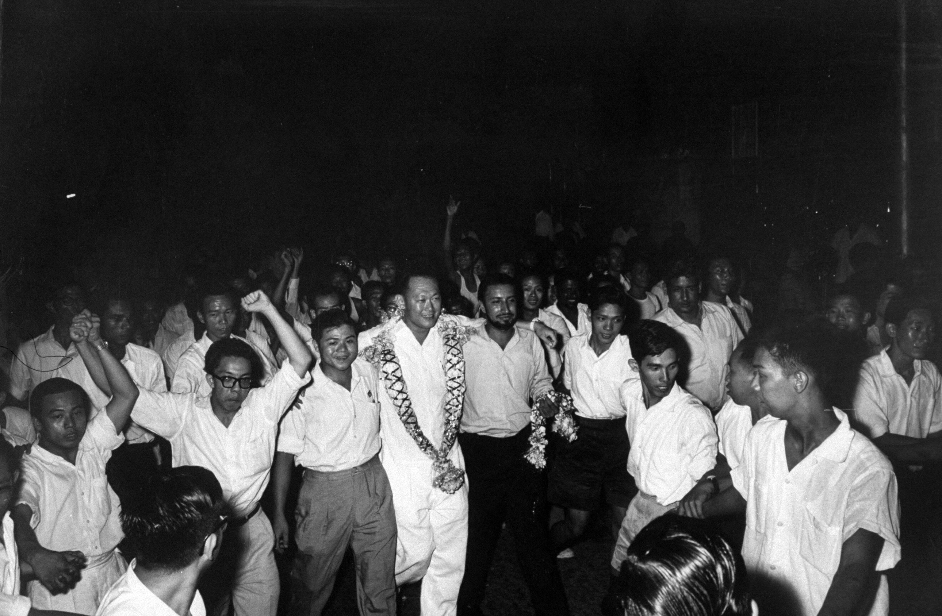 Lee Kuan Yew being congratulated by the crowd, Singapore, 1959.