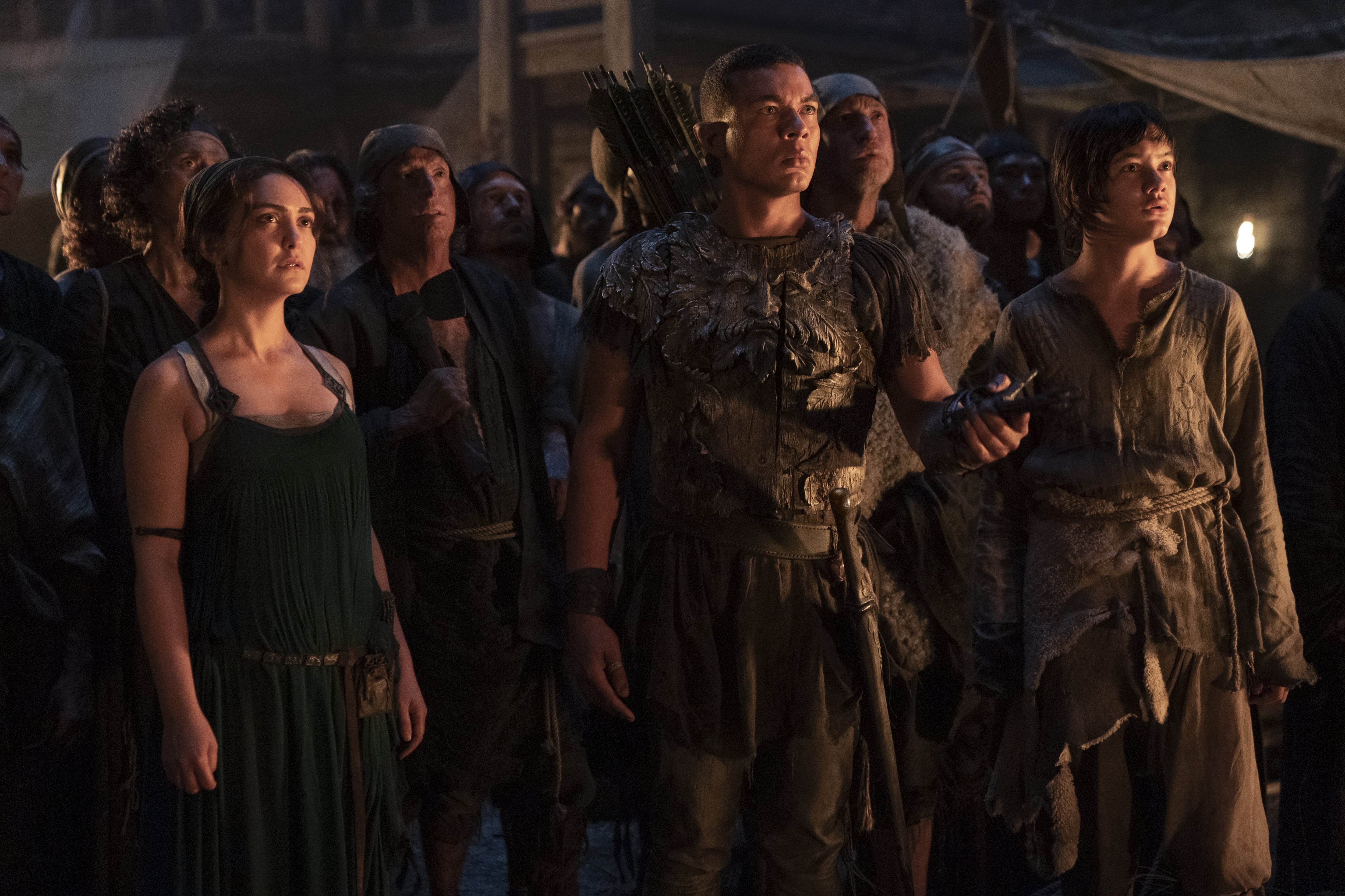 (L-R) Nazanin Boniadi as Bronwyn, Ismael Cruz Córdova as Arondir, and Tyroe Muhafidin as Theo in <i>The Rings of Power</i>