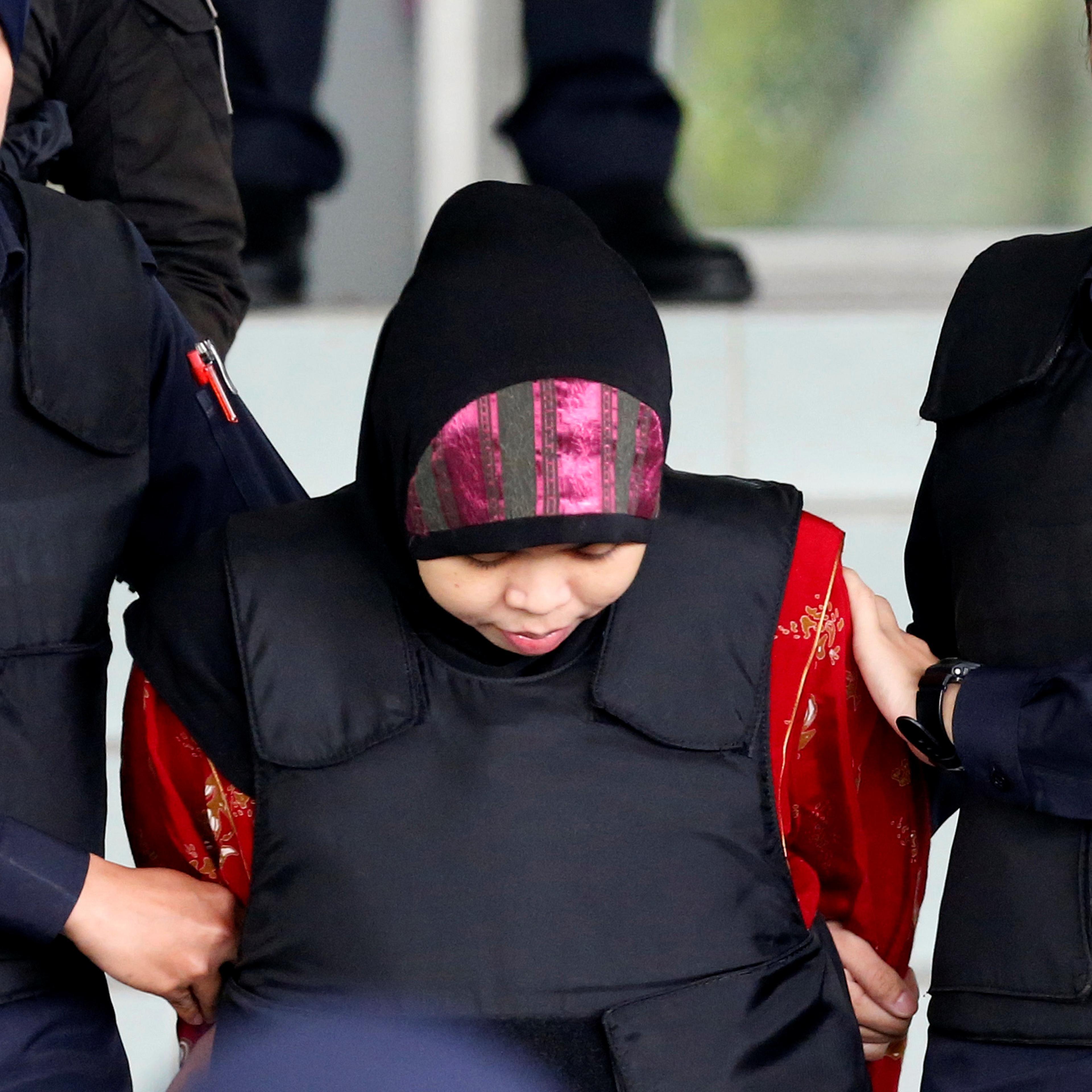 Indonesian Siti Aisyah is escorted as she leaves the Shah Alam High Court on the outskirts of Kuala Lumpur
