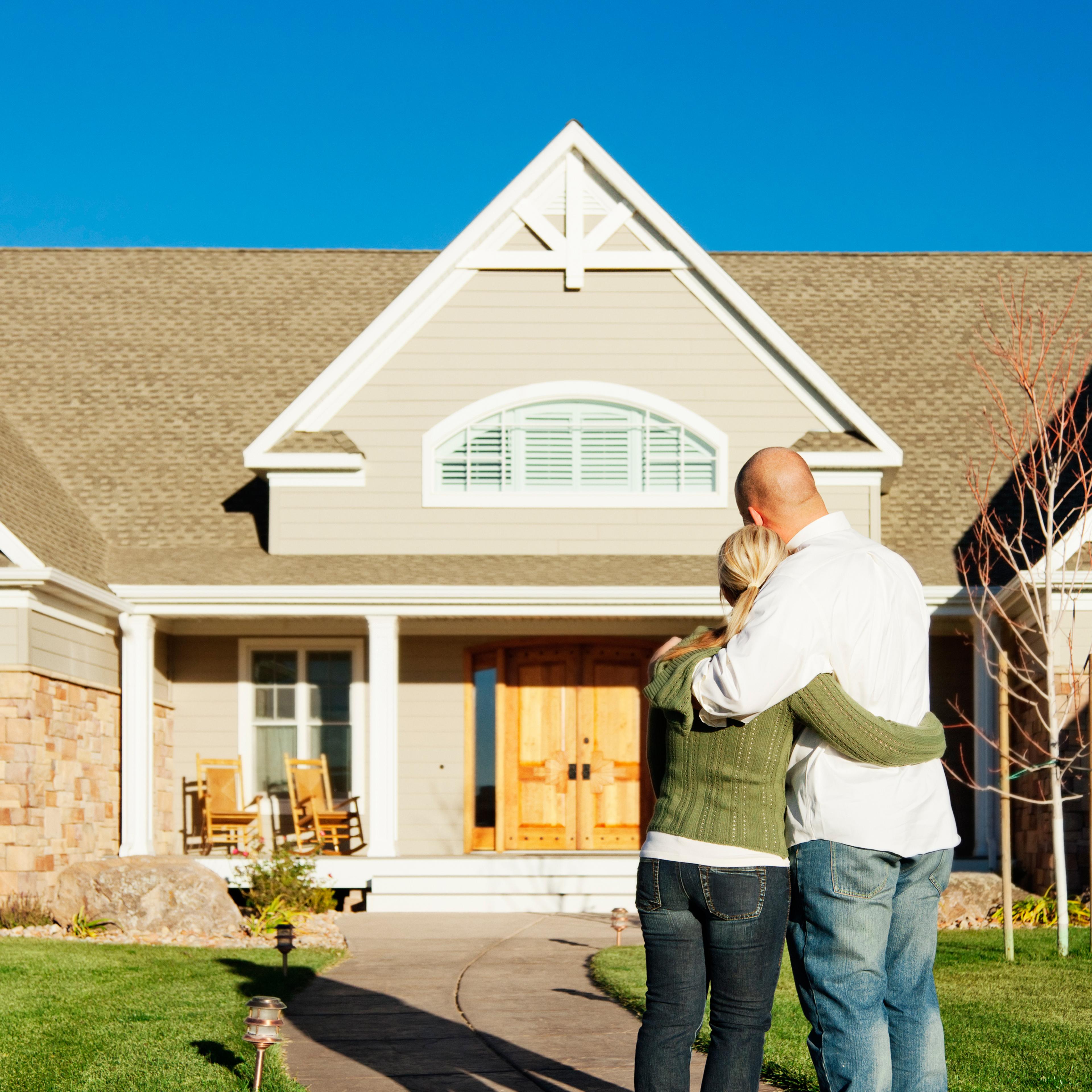 young couple admiring their new home