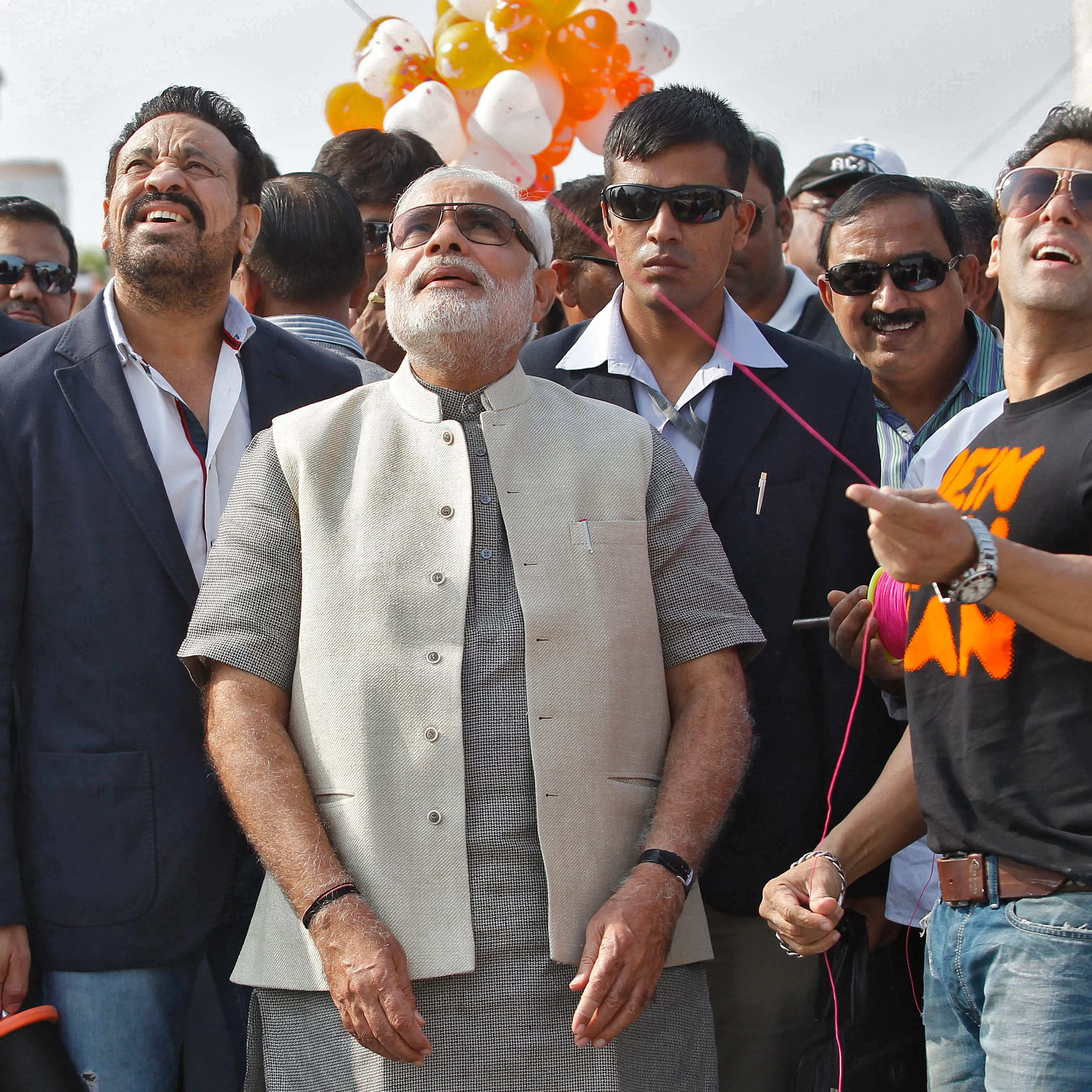 Bollywood actor Khan flies a kite as Hindu nationalist Modi watches during a kite flying festival in Ahmedabad
