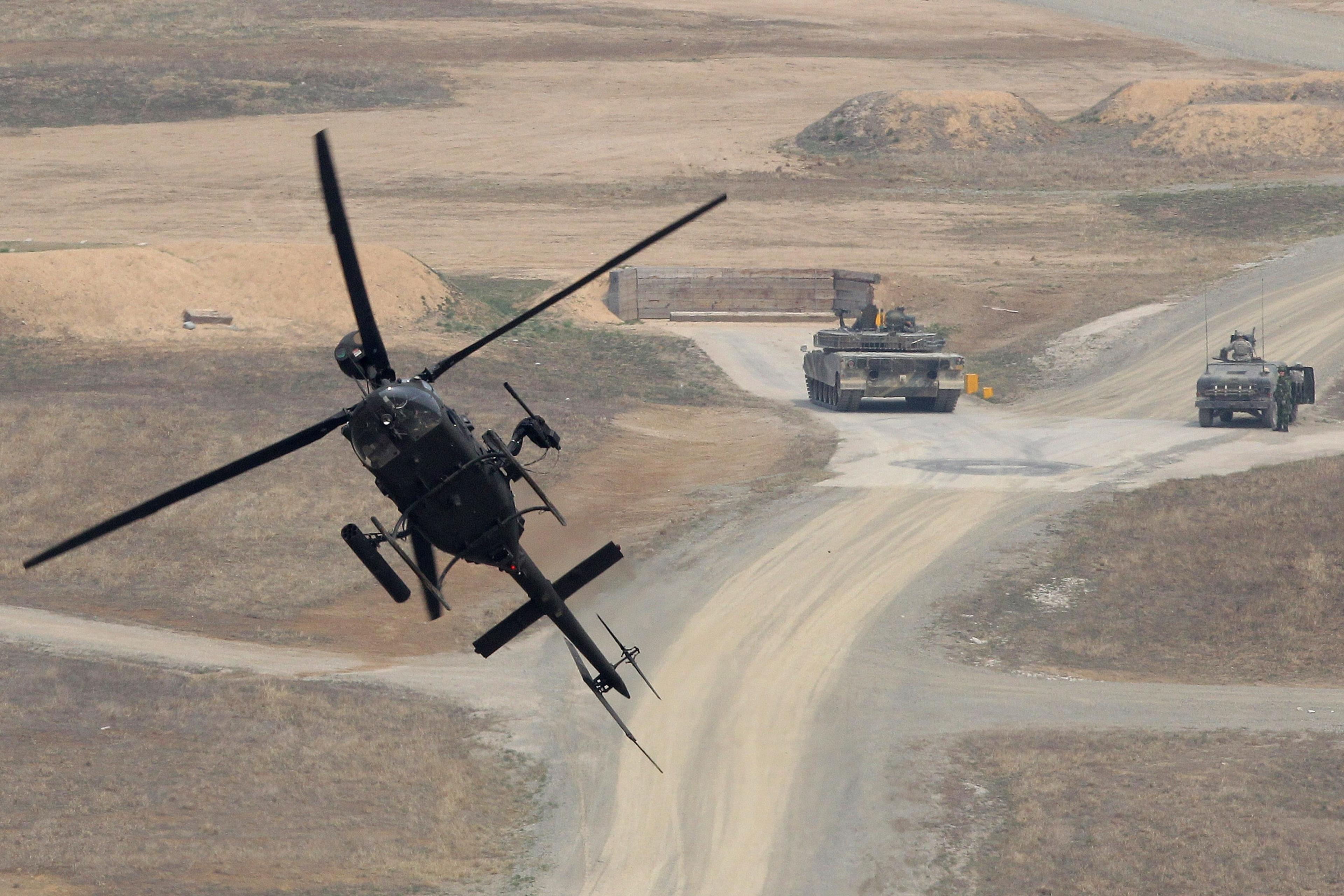POCHEON, SOUTH KOREA - APRIL 11: A Kiowa Warrior helicopter hover during the United States and South Korean Joint live fire Exercise at Rodriguez Range on April 11, 2014 in Pocheon, South Korea. This is a part of annual joint Combined Forces Command and
