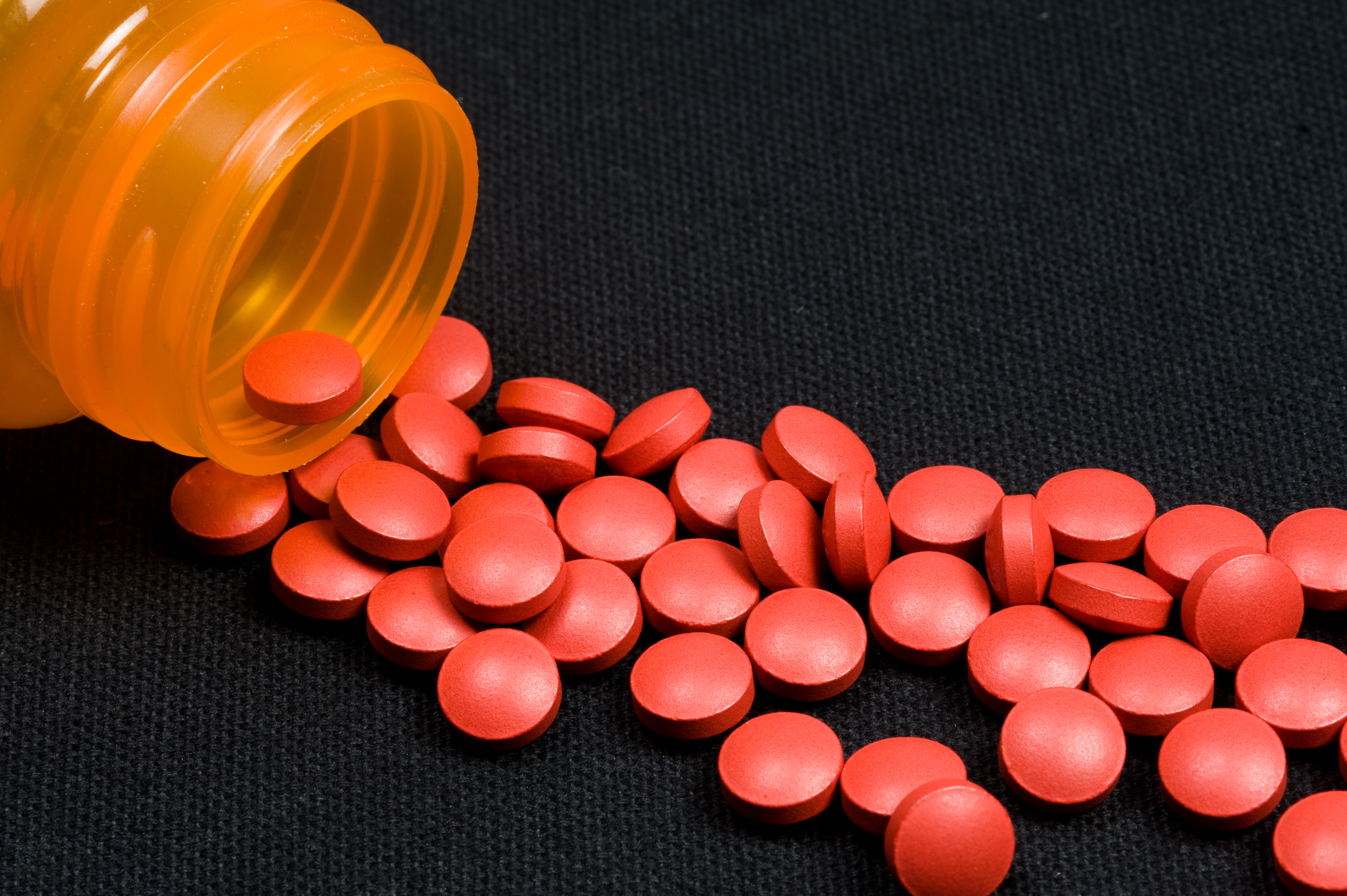 Tylenol Pills Spilling Out Of Bottle