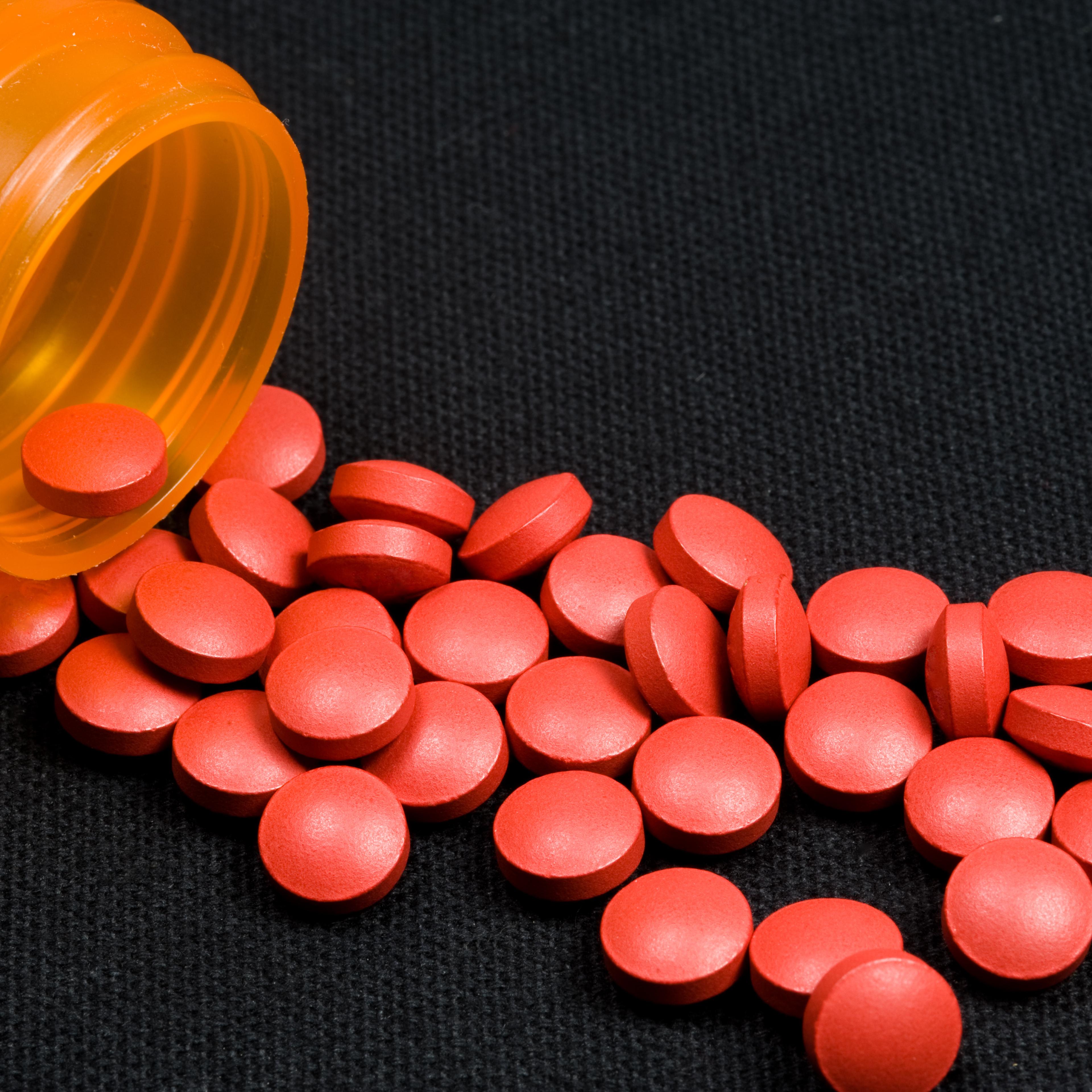 Tylenol Pills Spilling Out Of Bottle