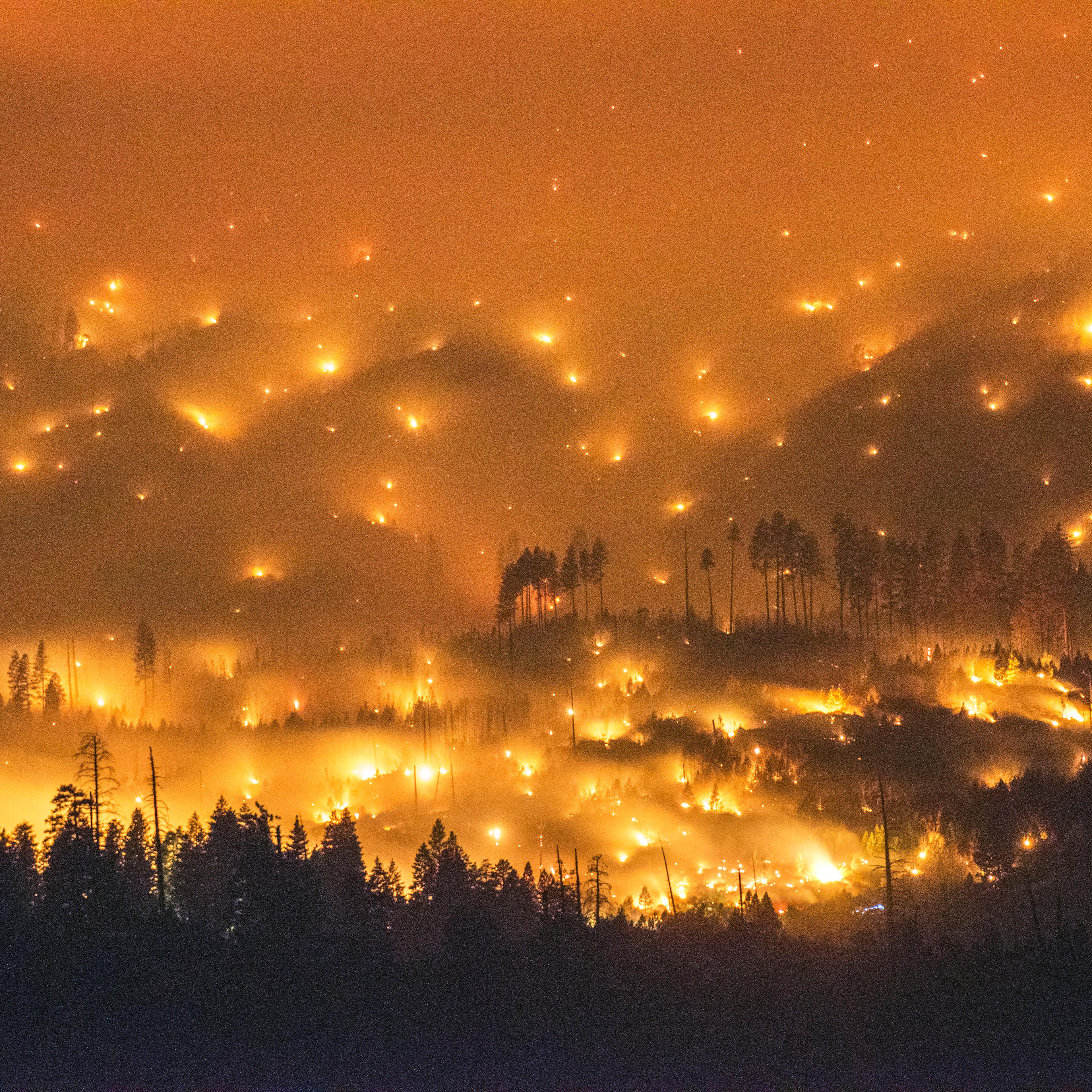 A long exposure image shows the El Portal Fire burning near Yosemite National Park, Calif., on July 27, 2014.